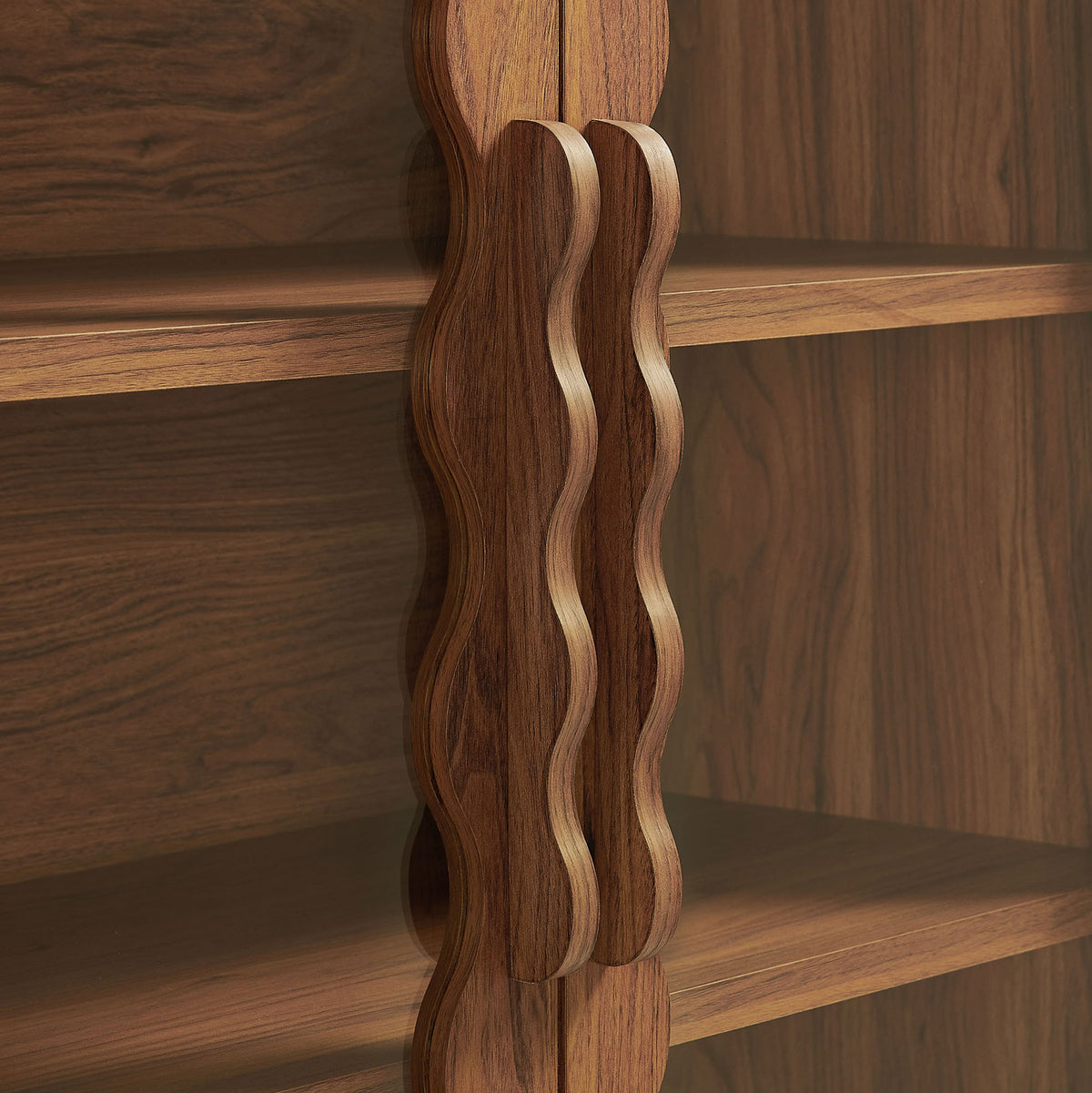 Sculpted wavy cabinet handles in a coordinating walnut wood finish || EEI-7589-WAL || handle_studio