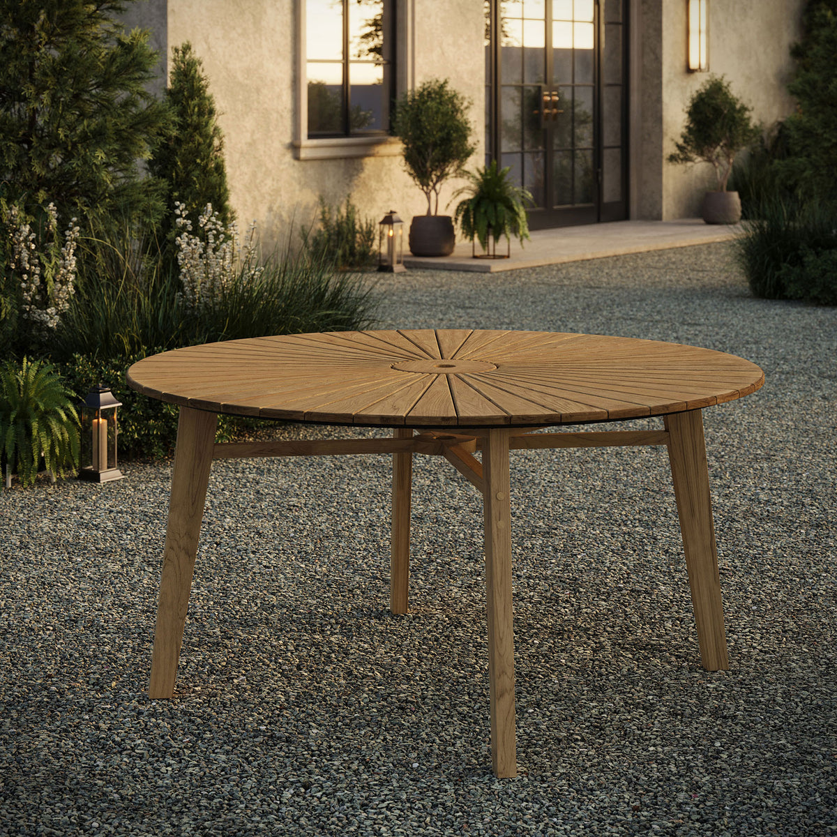 Cielo sunburst teak outdoor dining table adding warm natural wood tone to a landscaped patio || EEI-7601-NAT || front_angle_room