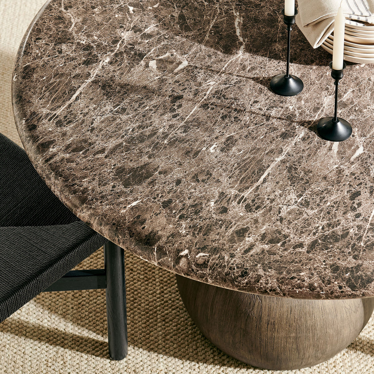 Styled place setting highlights the rich marble-look surface and beveled edge of the round table || EEI-7624-EMP || detail_room