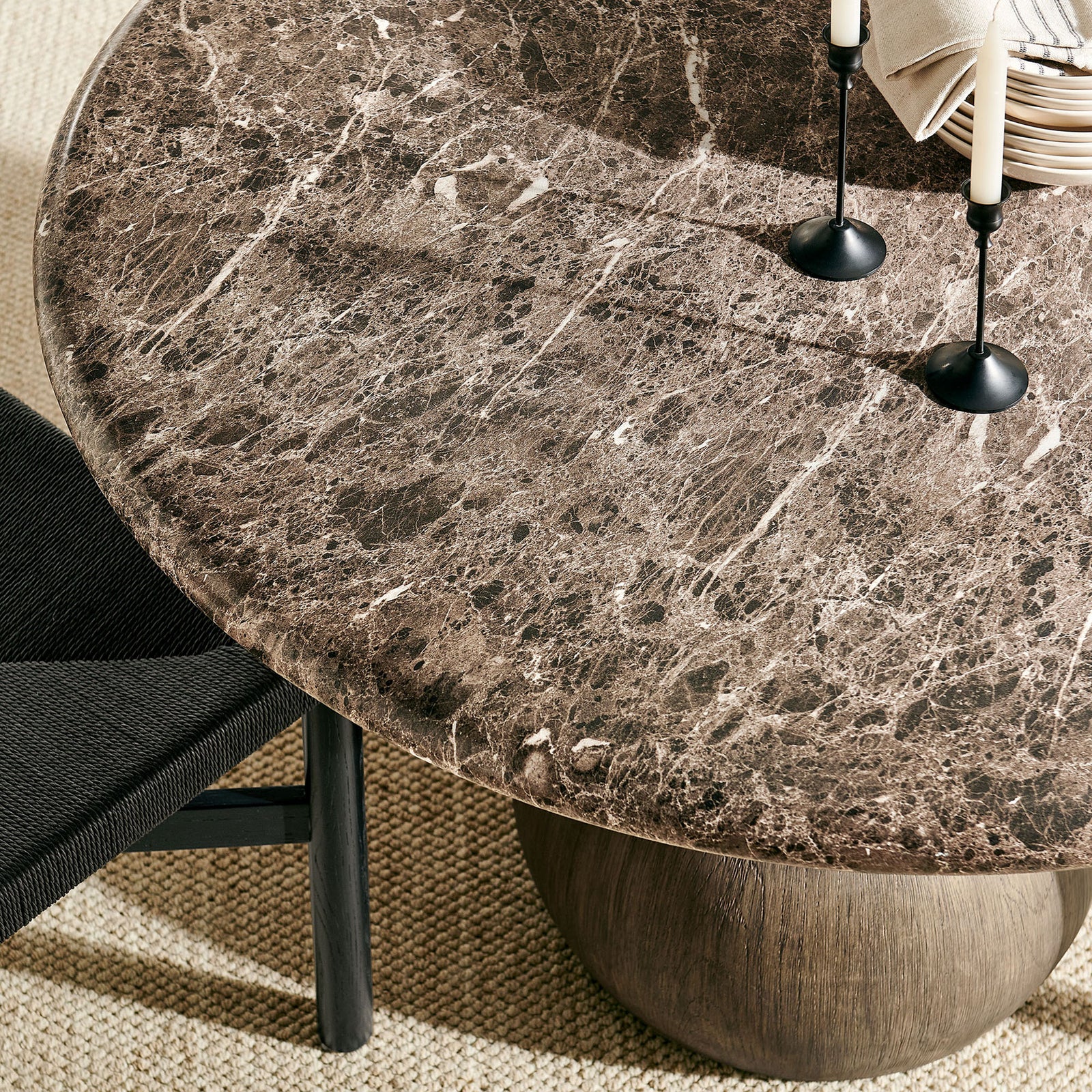 Styled place setting highlights the rich marble-look surface and beveled edge of the round table || EEI-7624-EMP || detail_room
