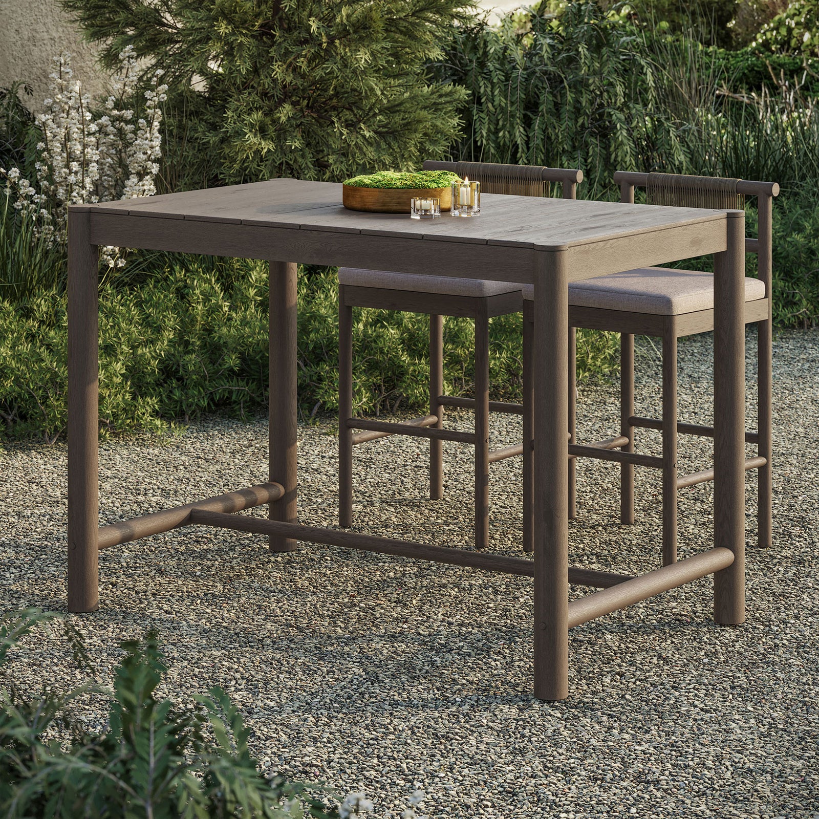 Weathered gray teak bar table anchors an intimate outdoor bar setting with matching stools || EEI-7629-WGR || front_angle_room