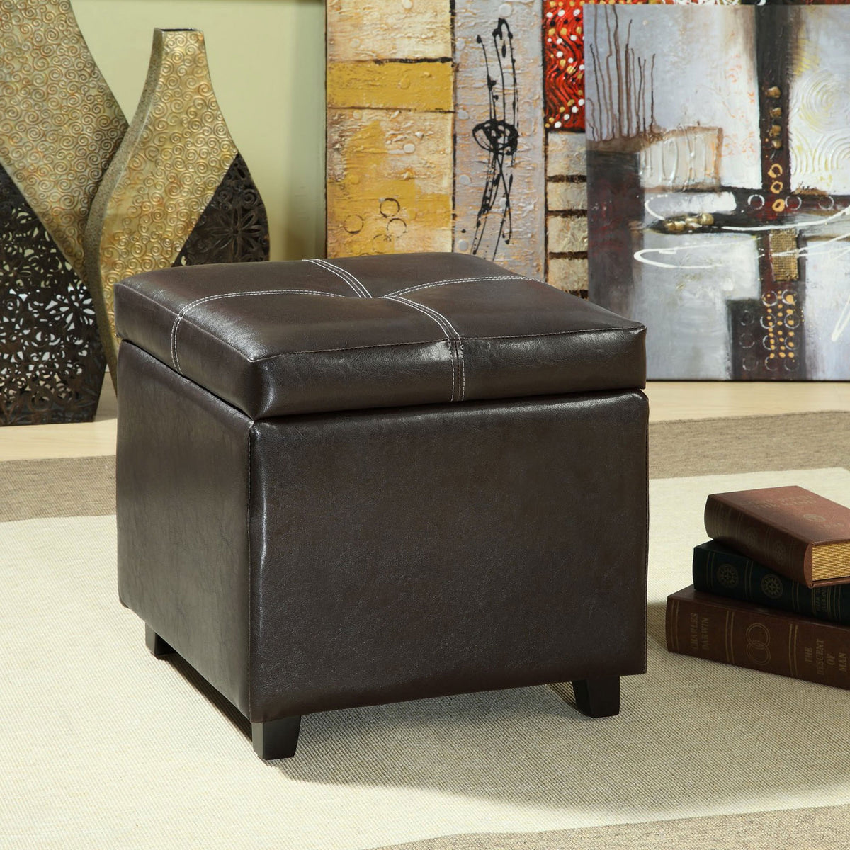 Espresso vinyl storage ottoman adds tailored comfort and hidden storage to a contemporary living room setting. || EEI-814-BRN || front_angle_room