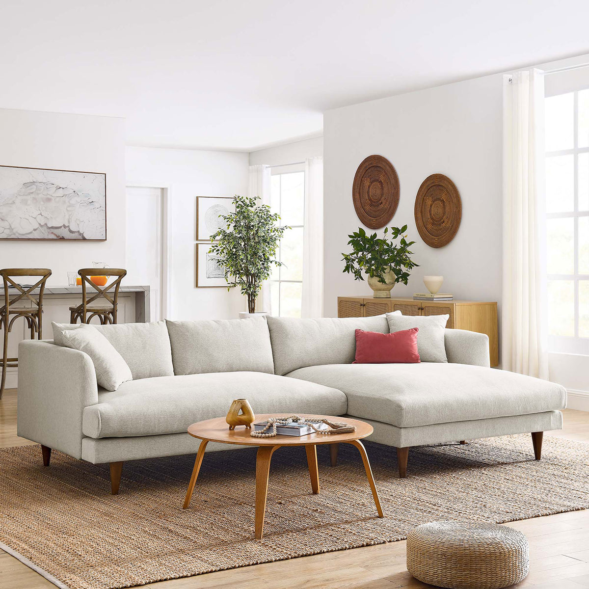 Ivory right-facing sectional styled in a bright living room with wood coffee table || EEI-6612-HEI || front_angle_room