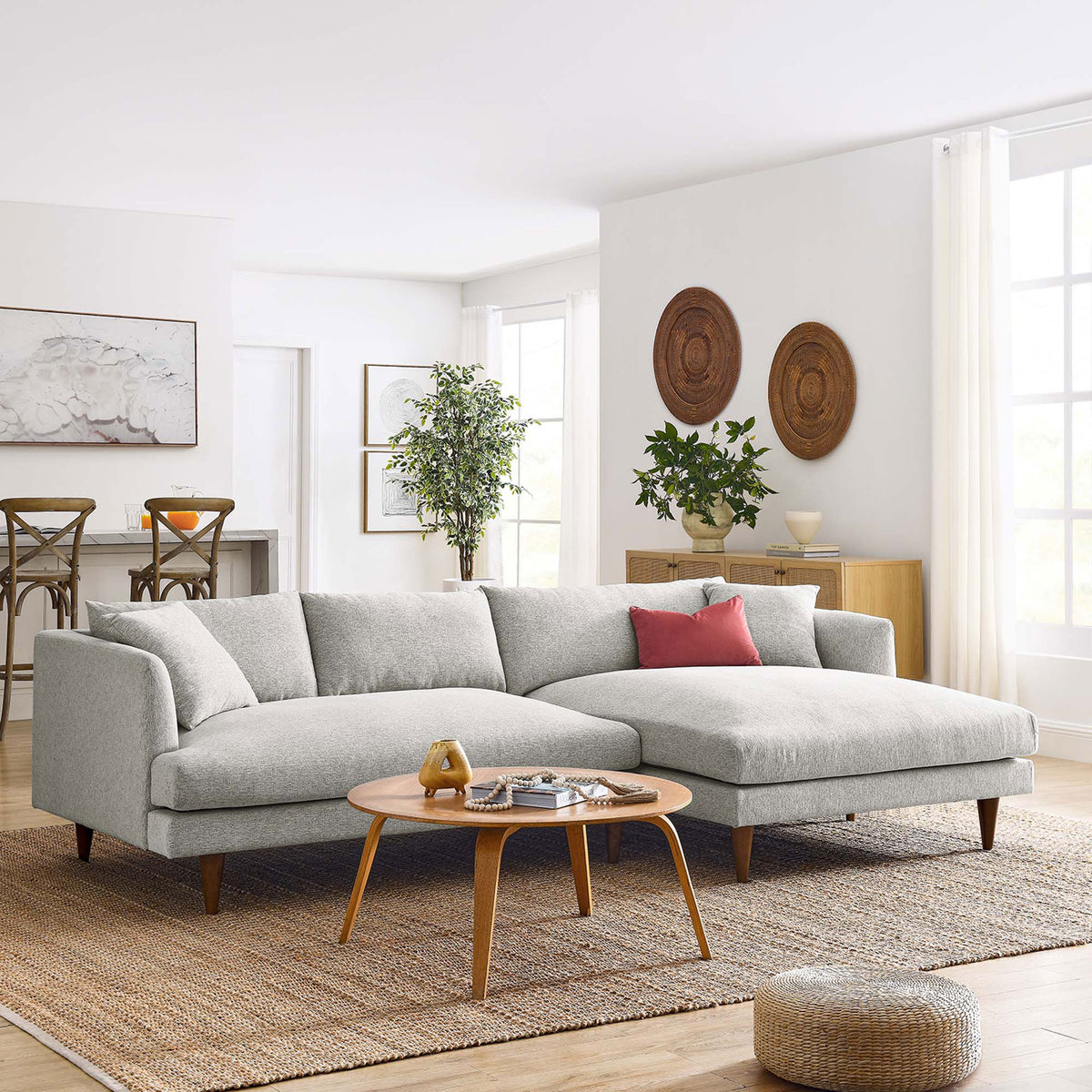 Spacious right-facing sectional anchoring a modern living room with neutral decor and mid-century wood accents || EEI-6612-HLG || front_angle_room