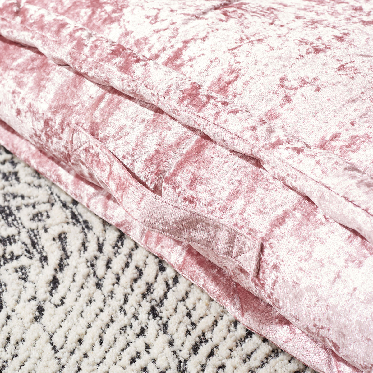 A stitched carry handle and plush piping complement the blush cushion's luminous fabric. || FLP1001B-2424 || handle_room