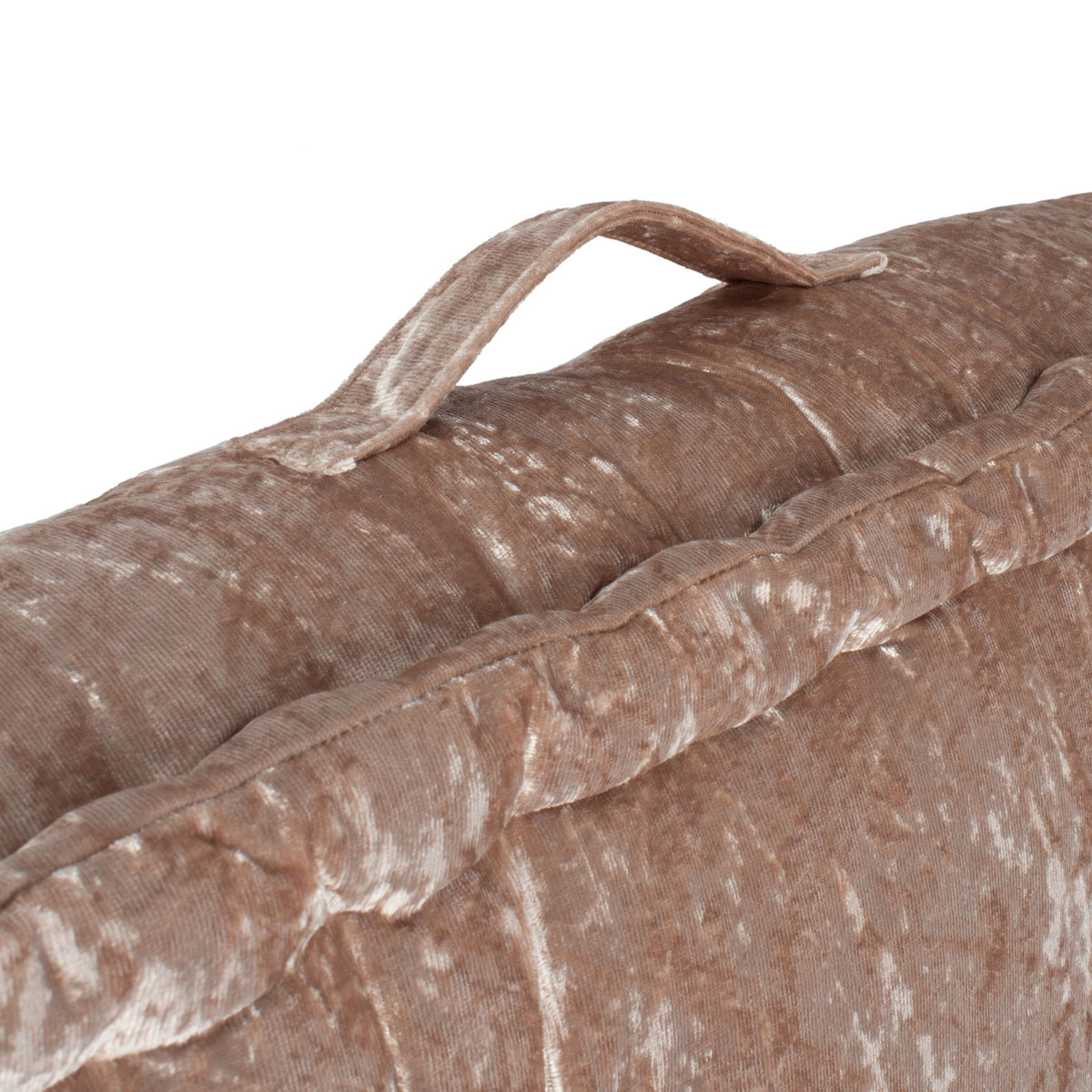 A champagne fabric carry loop arches above the cushion's soft, piped edge. || FLP1001F-1818 || handle_studio