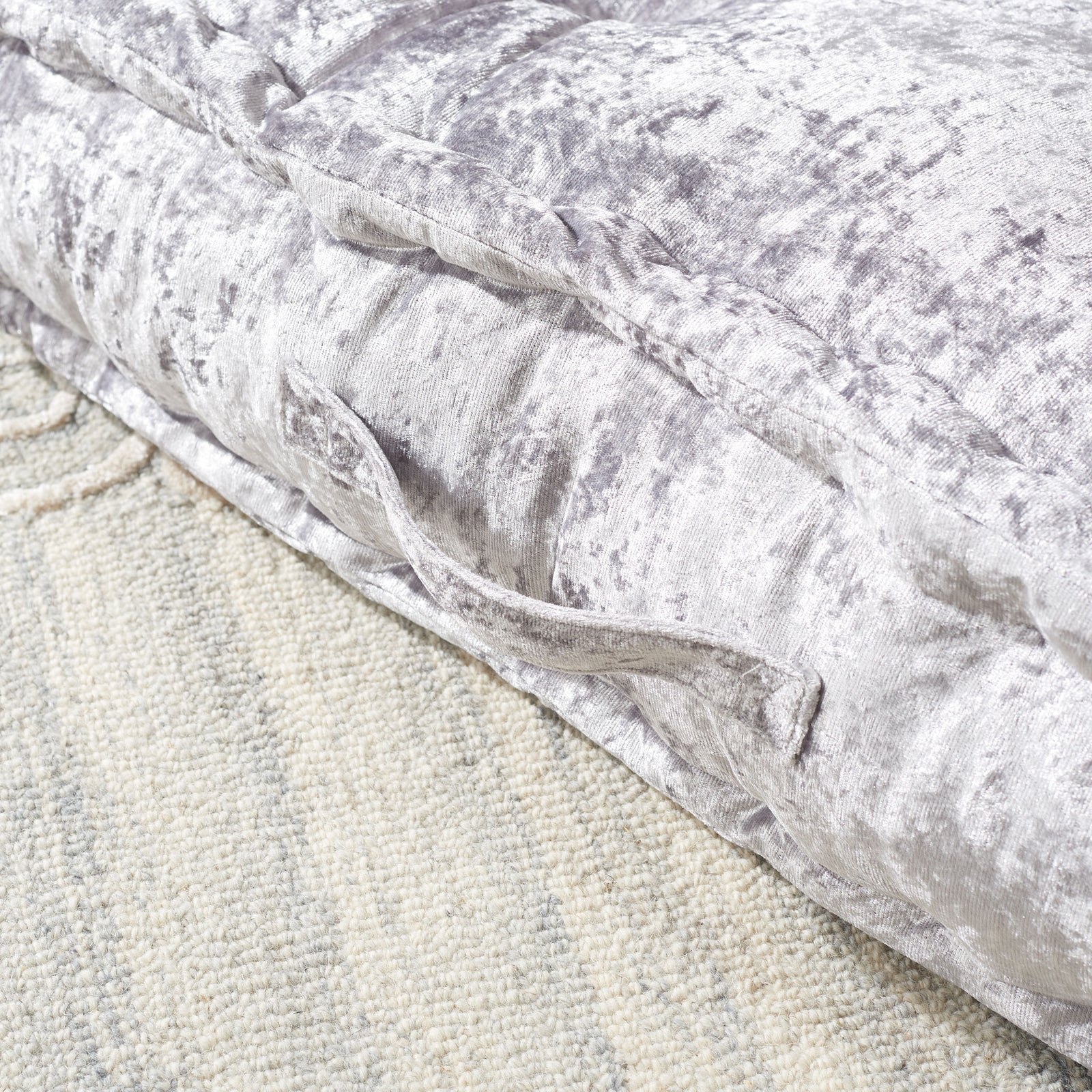 A silver fabric handle accents the pillow's lustrous, softly padded side. || FLP1001G-1818 || handle_room