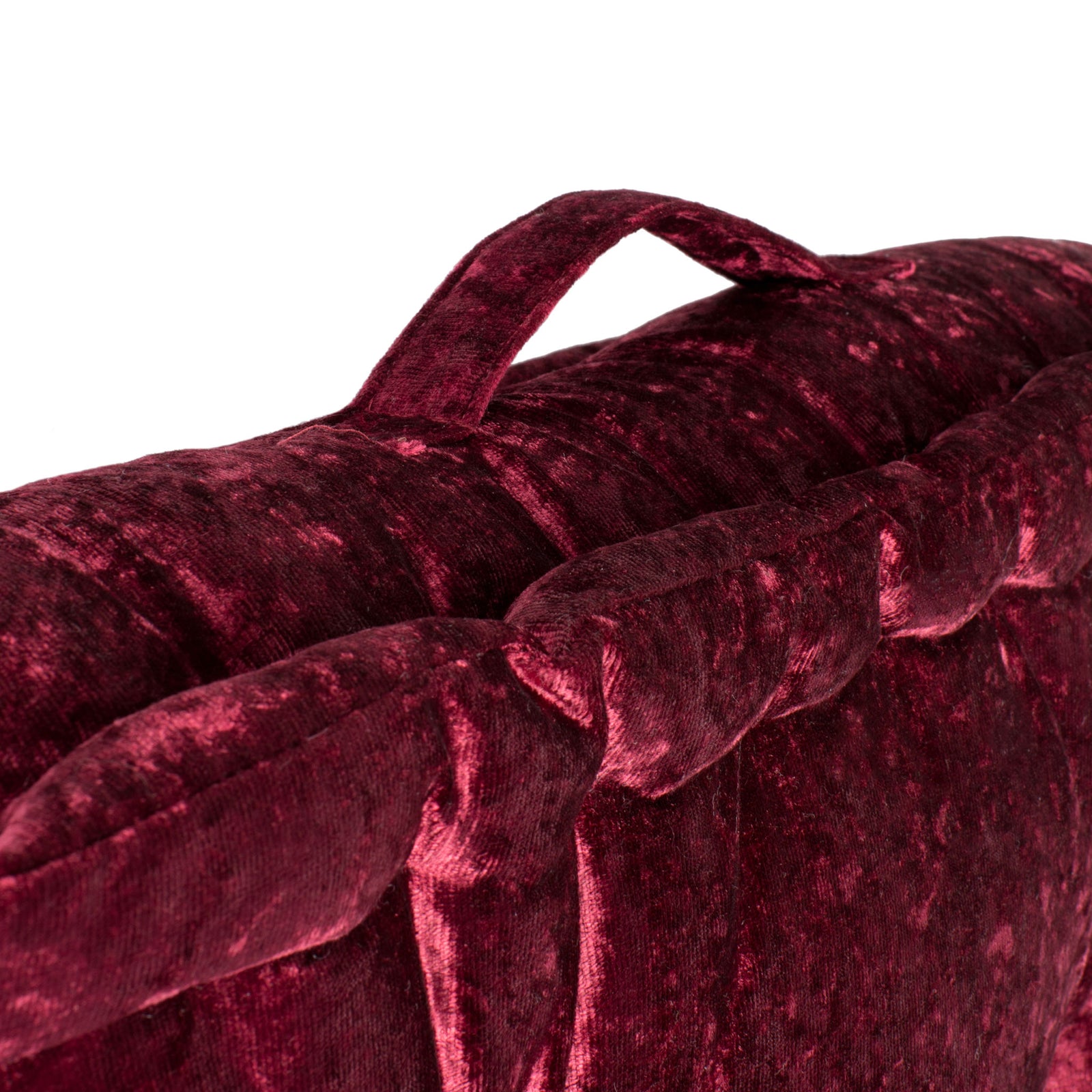 A matching fabric carry loop rises from the burgundy cushion's padded edge. || FLP1001H-1818 || handle_studio