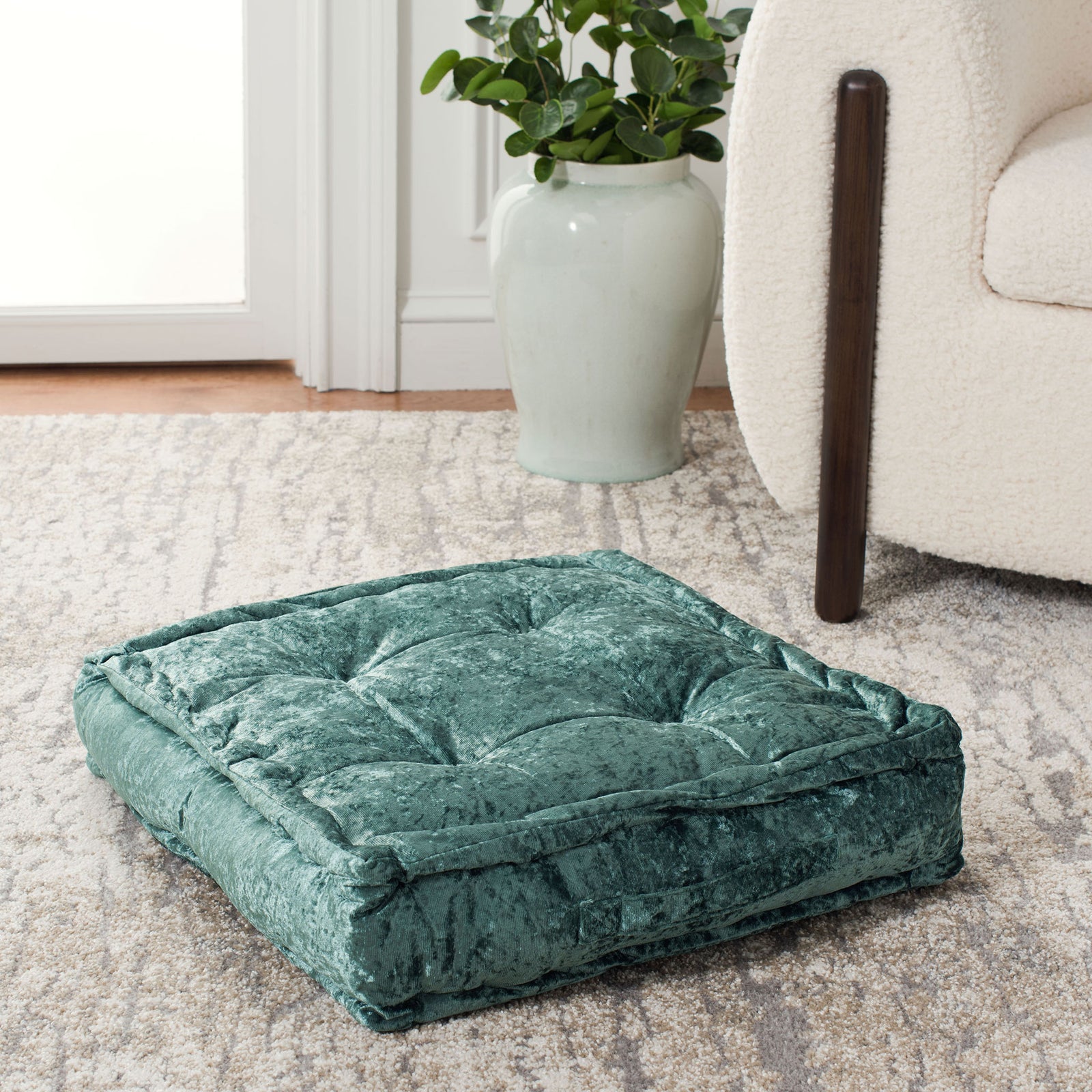 A velvety green floor cushion blends generous padding with a softly raised border. || FLP1001J-1818 || front_angle_room