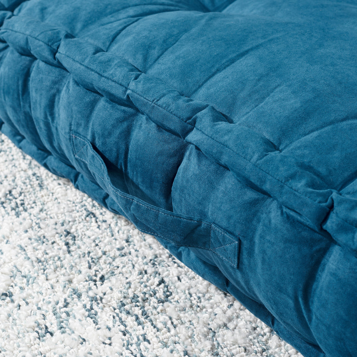 Dark turquoise floor pillow with a sewn carry handle and soft, gathered sidewalls || FLP1002B || handle_room