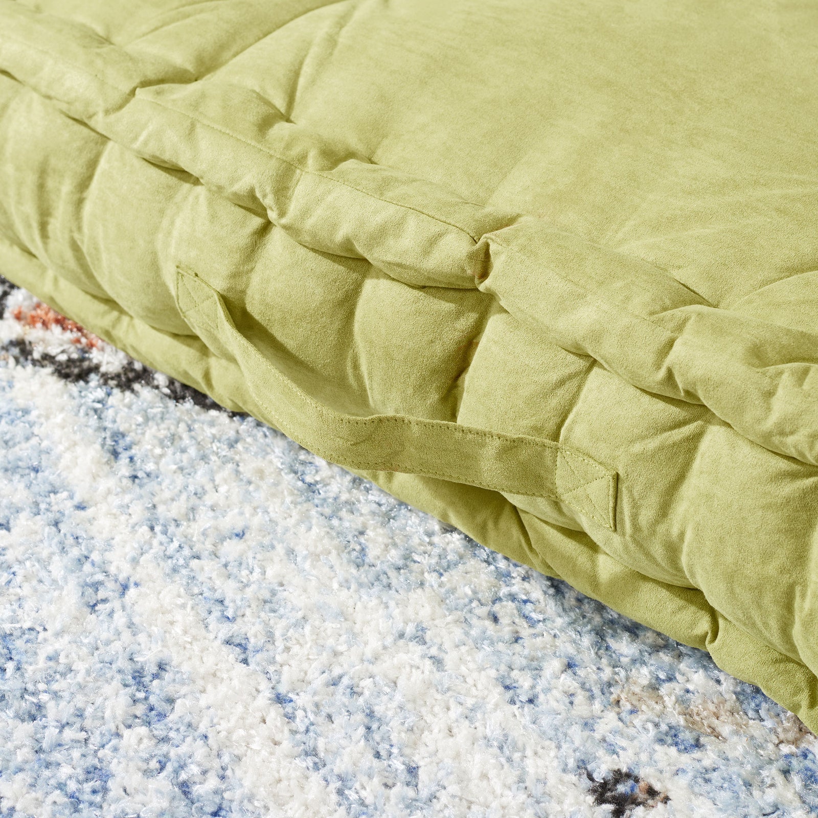 Light green floor pillow with a sewn carry handle and plush, gathered side panels || FLP1002F || handle_room