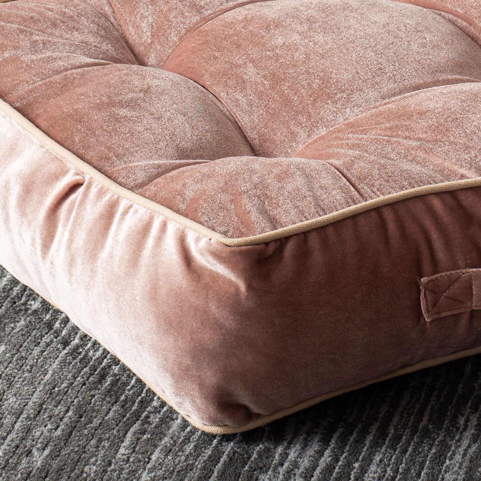 Soft pink velvet and piped edges frame the floor pillow's thick, deeply tufted cushion || FLP1004C || detail_room