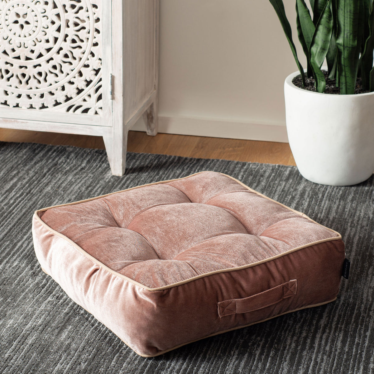 Blush pink velvet floor pillow with deep tufting and a side handle for easy moving || FLP1004C || front_angle_room