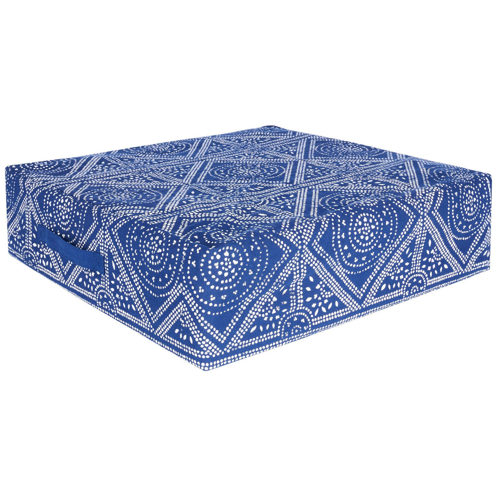 Thick square floor pillow wrapped in navy fabric with white dotted medallions and a side carry handle || FLP1010A || front_angle_studio