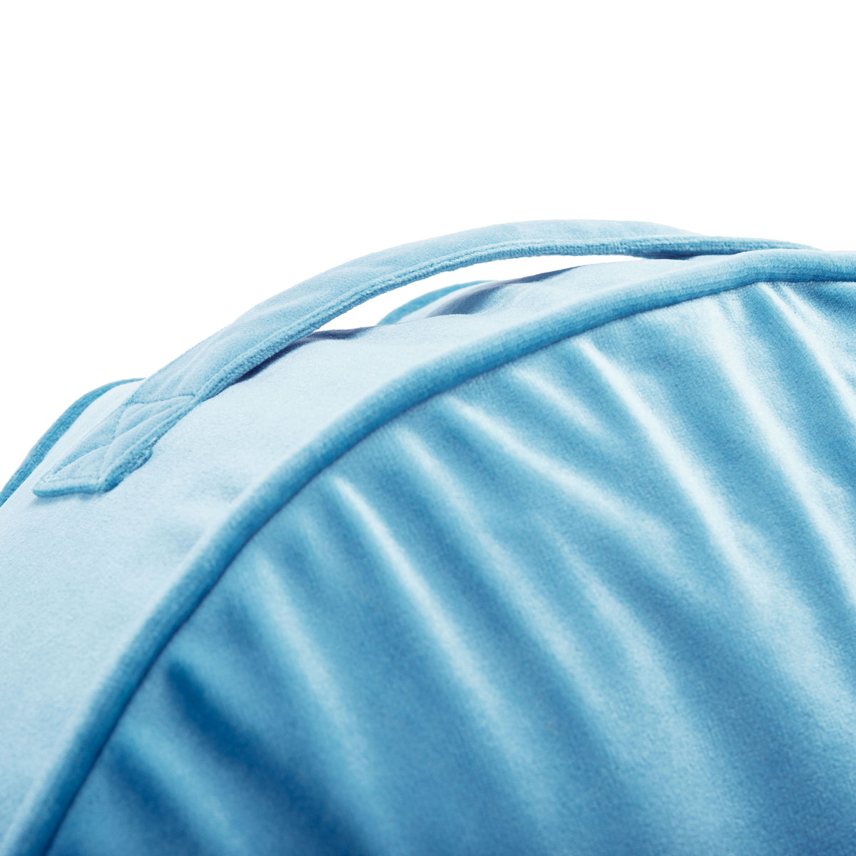 A stitched blue carry handle and piped seam add practical detail to this floor pillow