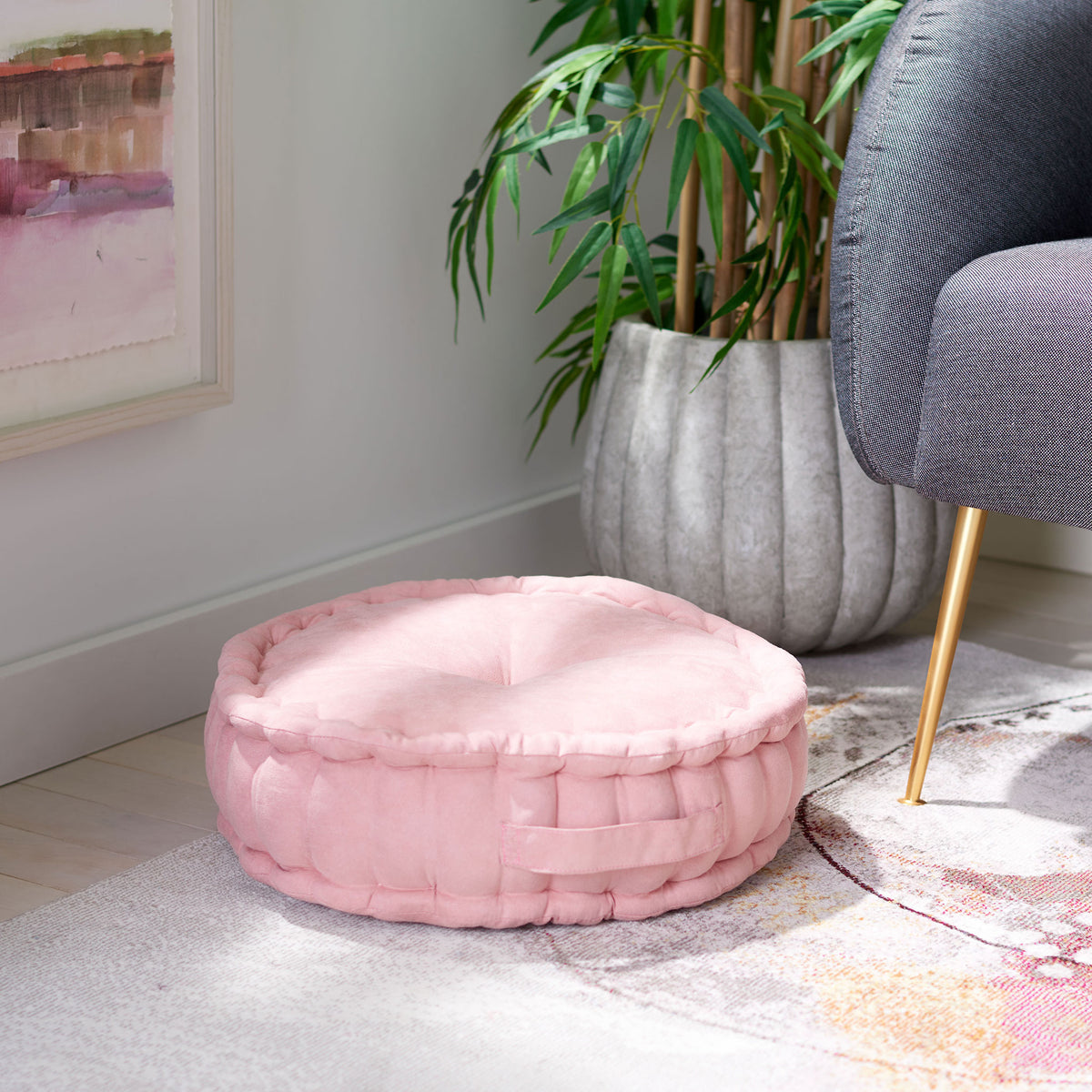 Light pink floor pillow offers soft extra seating with a deep center tuft and side carry handle || FLP1014B || front_angle_room