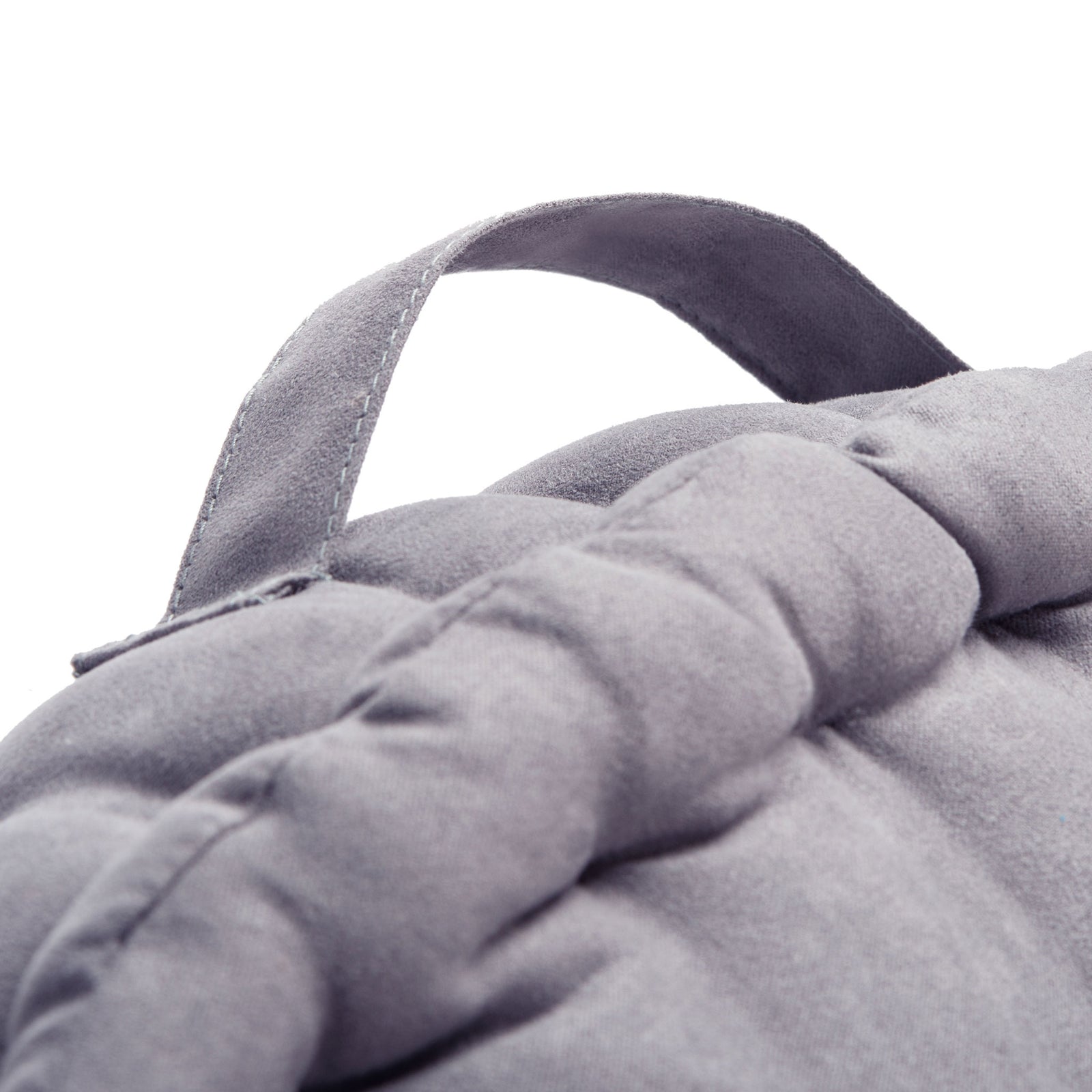 Stitched gray carry handle arches over the cushion's soft, pleated edge || FLP1014D || handle_studio
