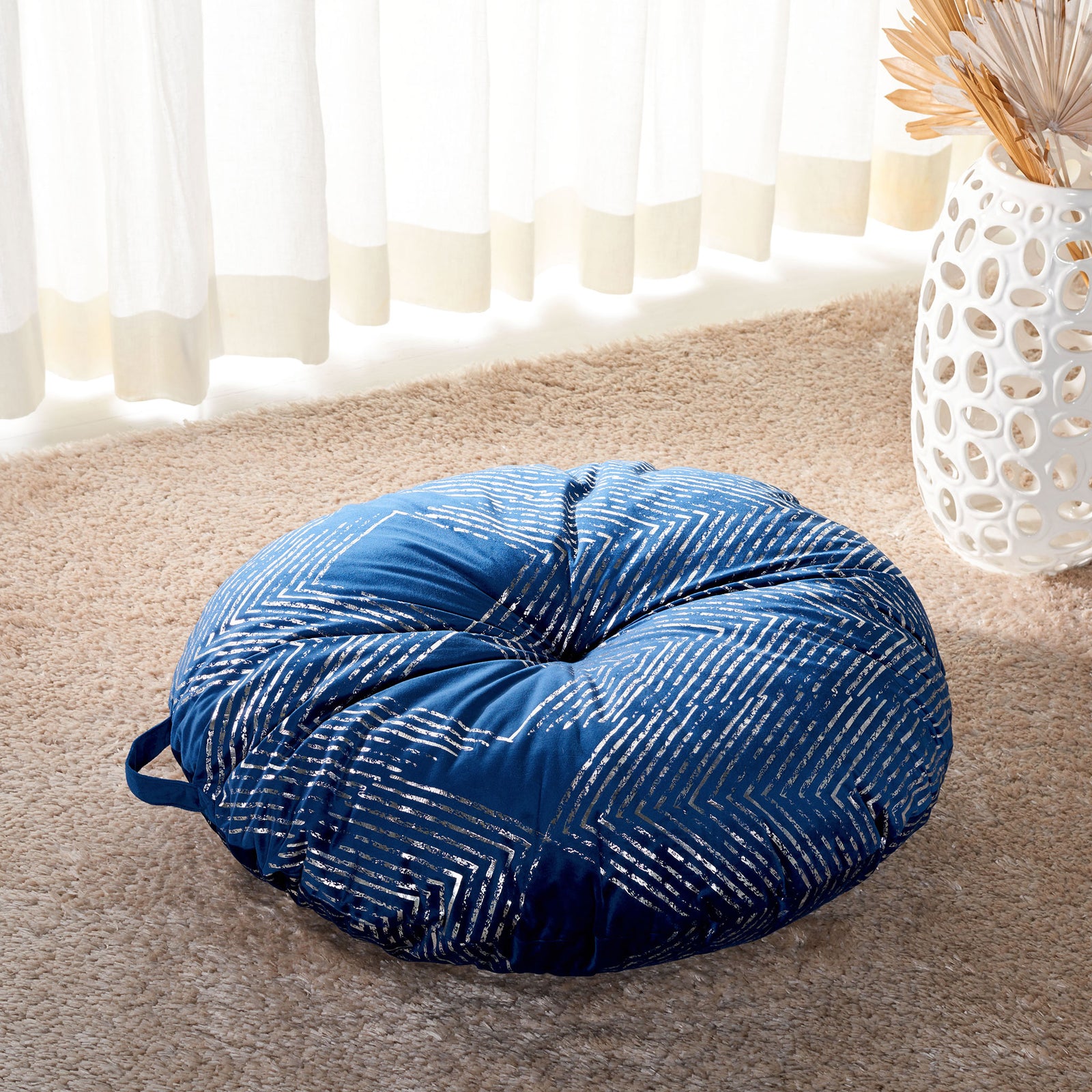 Plush navy floor cushion with a gathered center and glimmering silver chevrons || FLP1024B-2626RD || front_angle_room