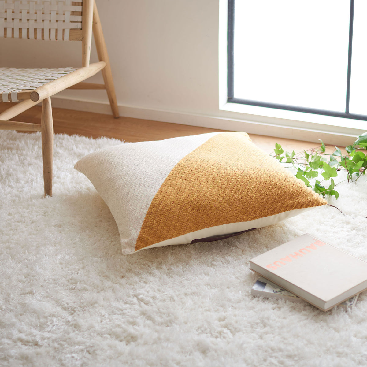 Soft beige and mustard floor pillow adds warmth to a cozy lounging space || FLP3005A || front_angle_room