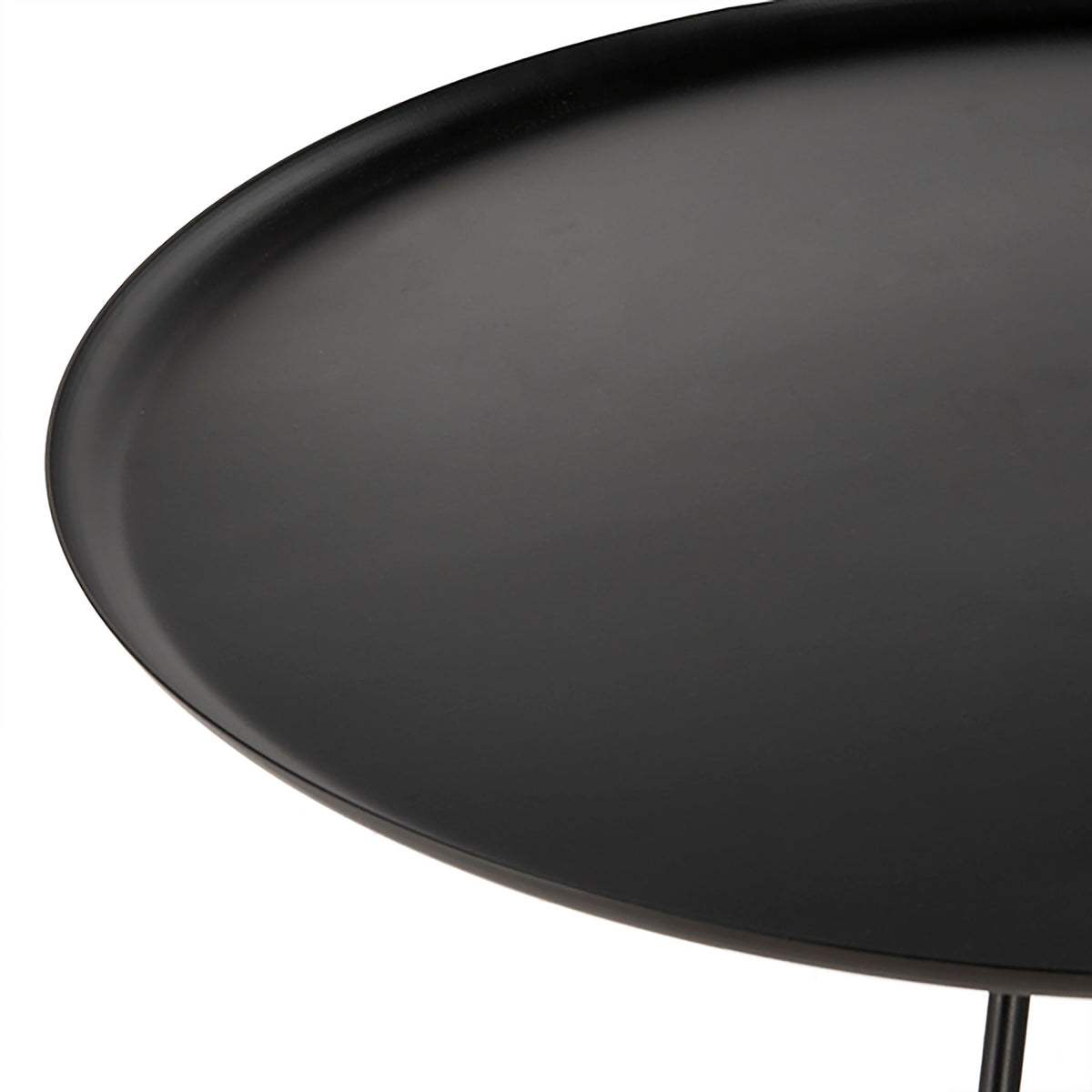 Spacious circular tabletop with a subtly recessed surface and curved edges to keep essentials in place.