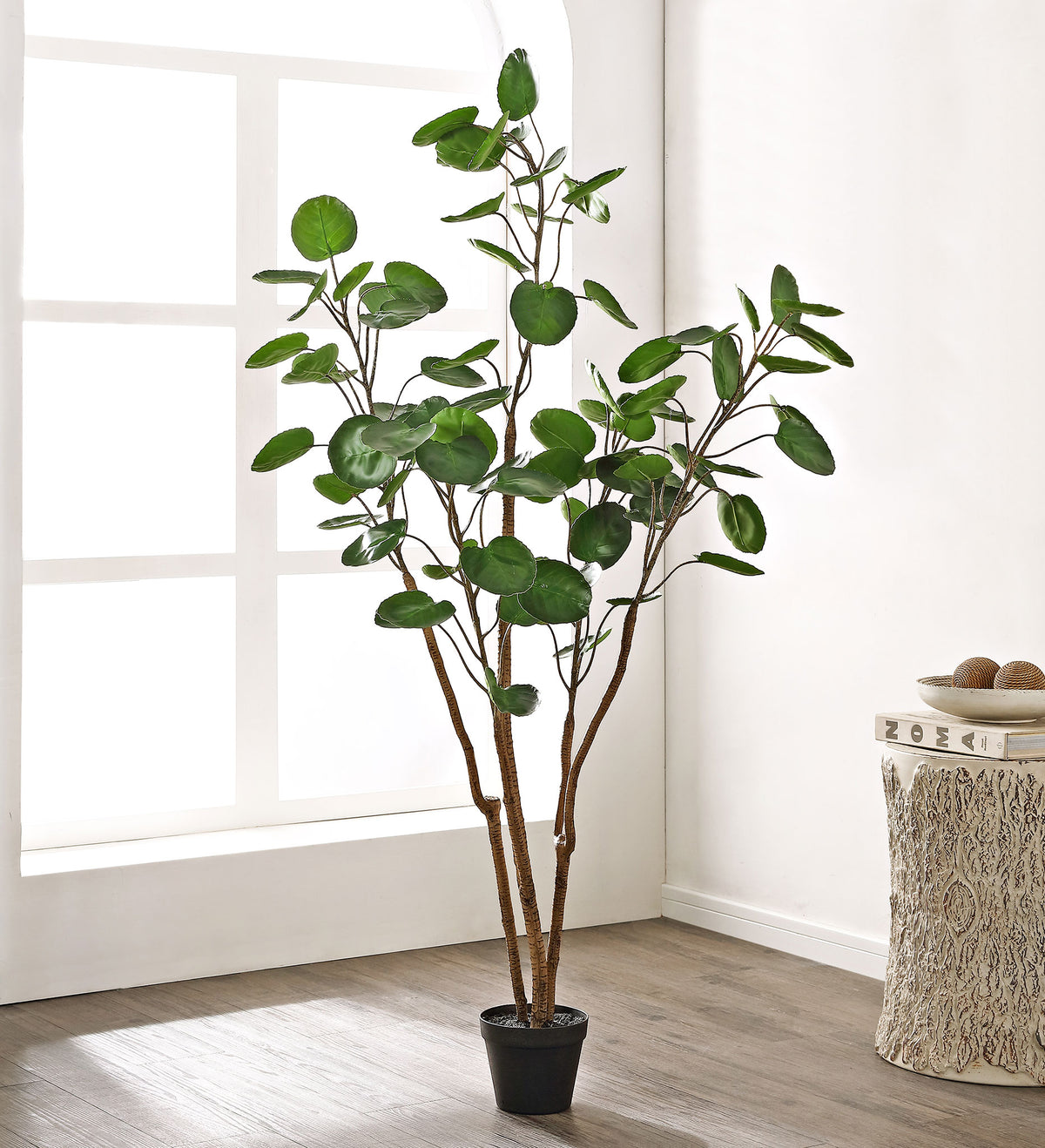 A lightly branched faux tree gives a living space an organic accent. || FXP1003A || front_room