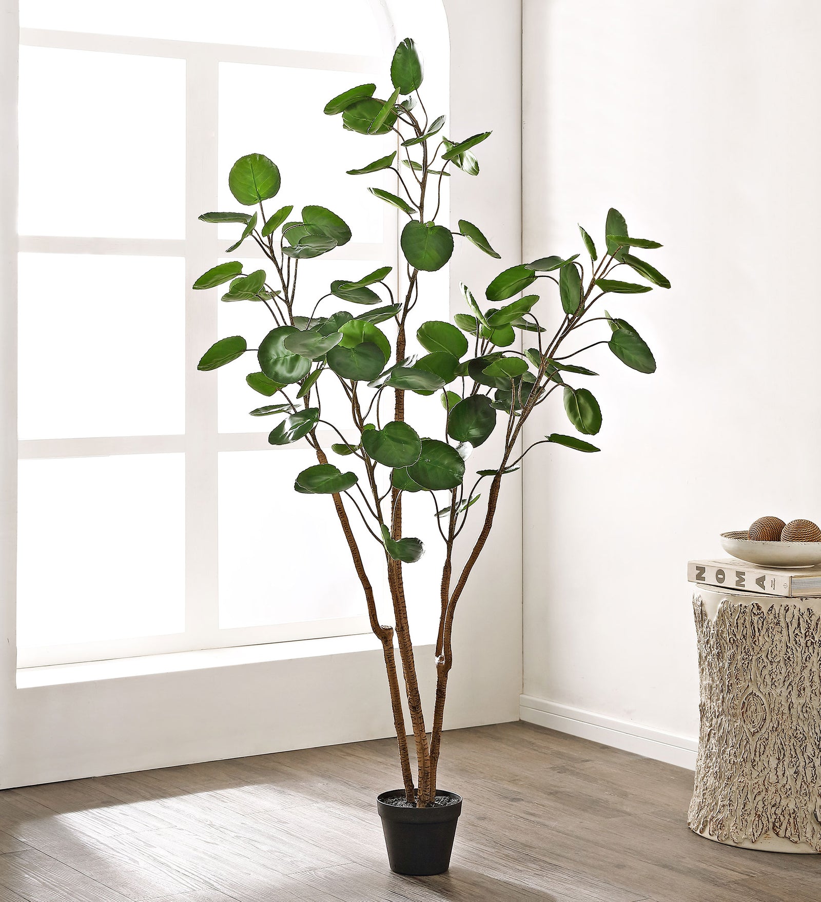 A lightly branched faux tree gives a living space an organic accent. || FXP1003A || front_room