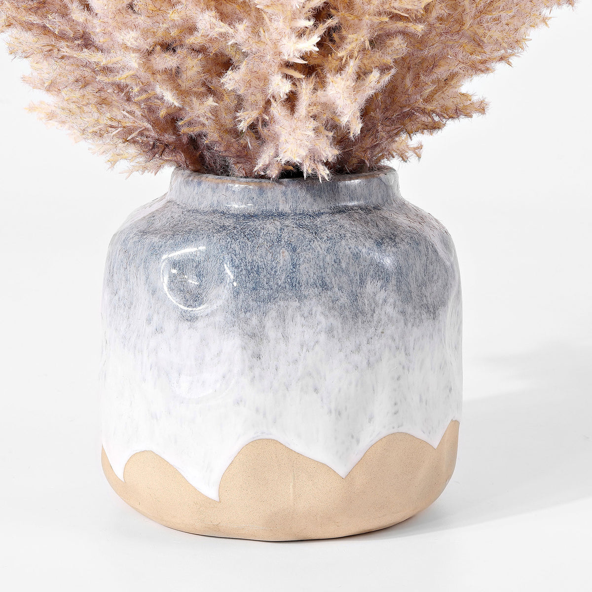 A blue-gray ceramic pot has a soft white glaze and natural clay base. || FXP1019A || leg_studio