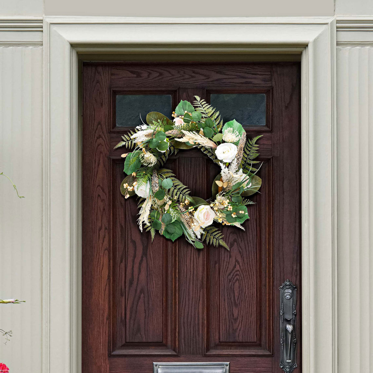 Cream roses and fern fronds lend a natural spring touch to a dark door. || FXP1023A || front_room