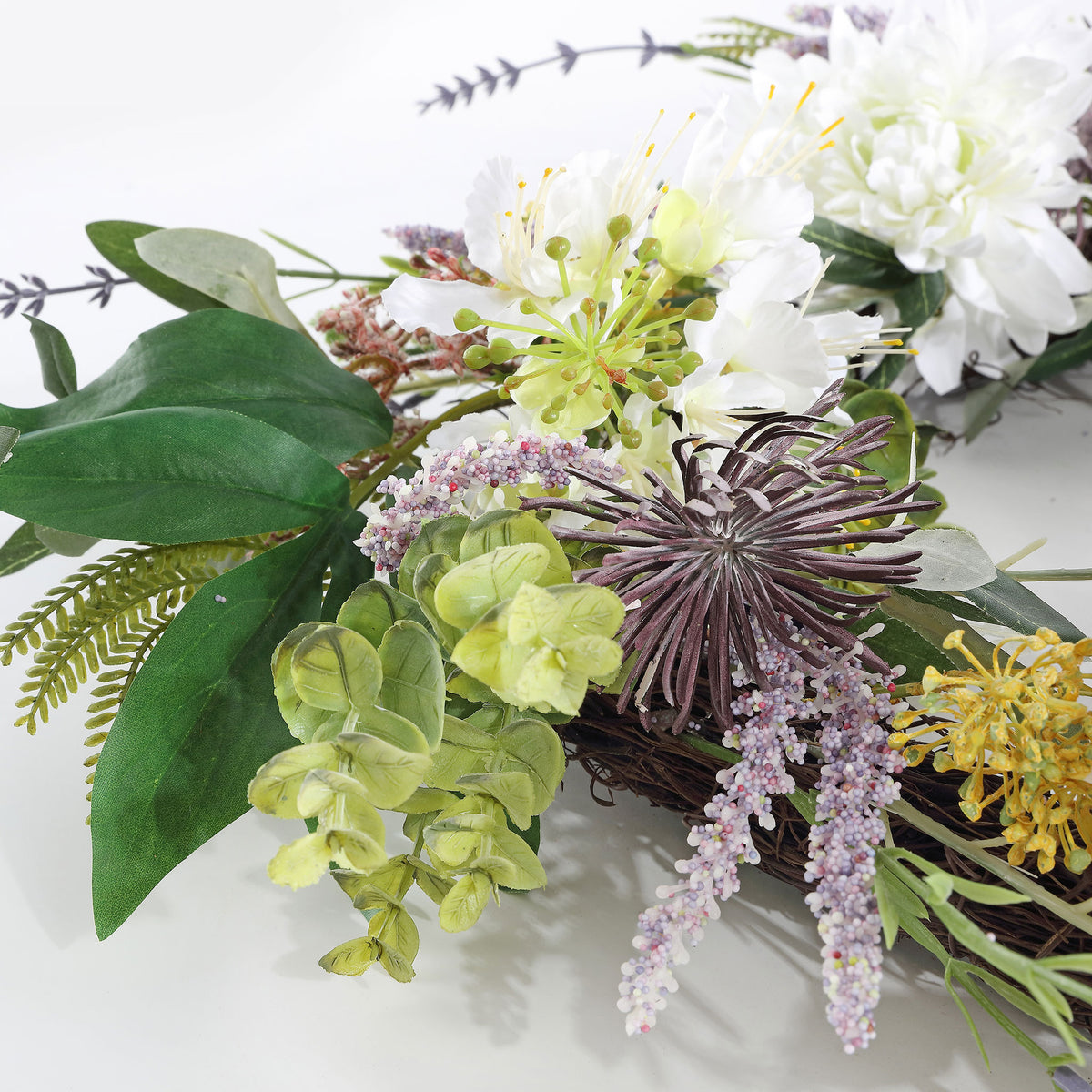 Pale flowers, purple sprigs, and greenery add varied spring texture. || FXP1028A || detail_studio