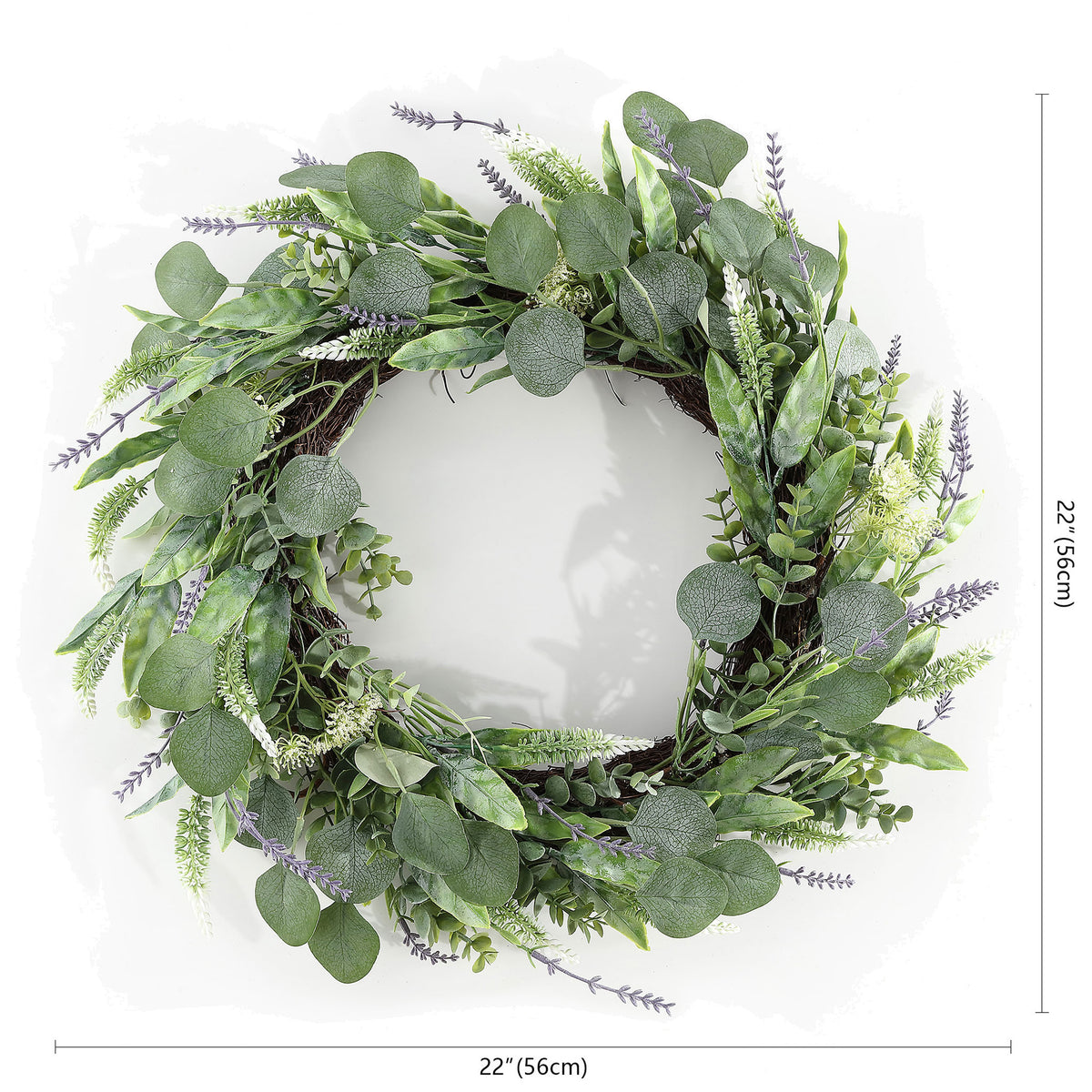 A 22-inch wreath layers eucalyptus greens with delicate purple stems. || FXP1029A || dimension_studio