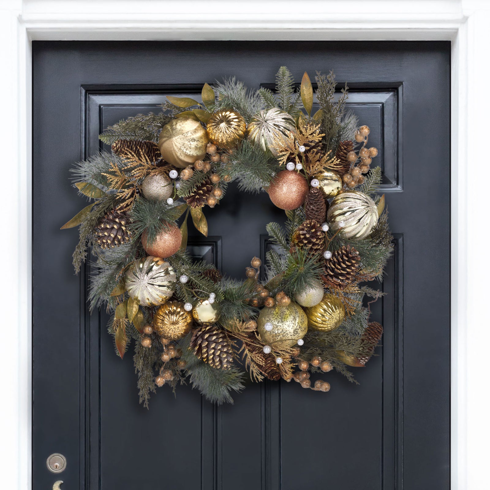 Gold ornaments and evergreen sprigs bring festive sparkle to a dark door. || FXP1033A || front_room