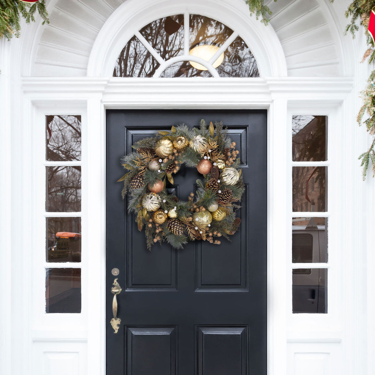 A glittering pine wreath gives the entryway a warm holiday welcome. || FXP1033A || front_room