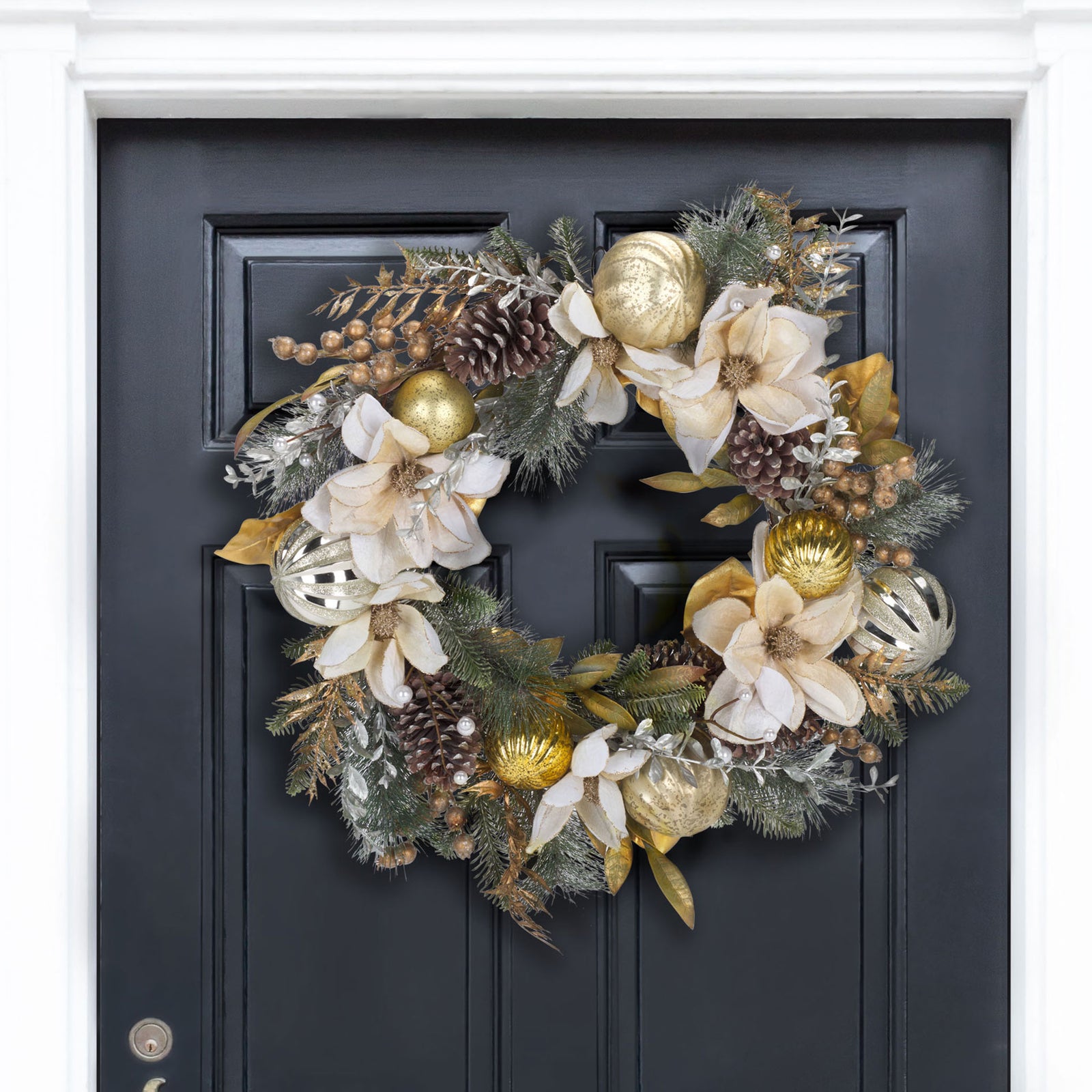 White poinsettias and gold ornaments brighten a dark entry door. || FXP1034A || front_room