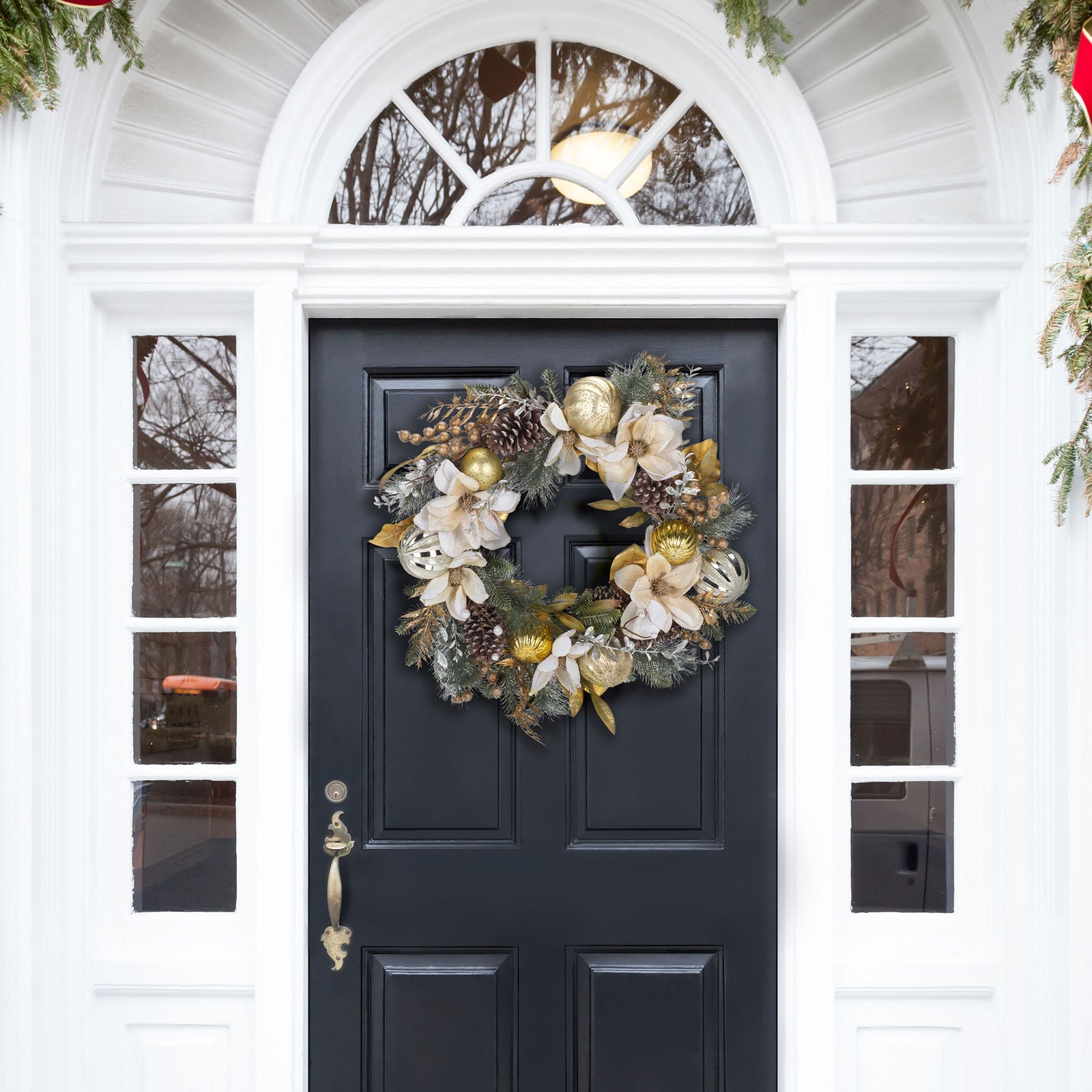 A gold-accented floral wreath brings festive warmth to the entryway. || FXP1034A || front_room