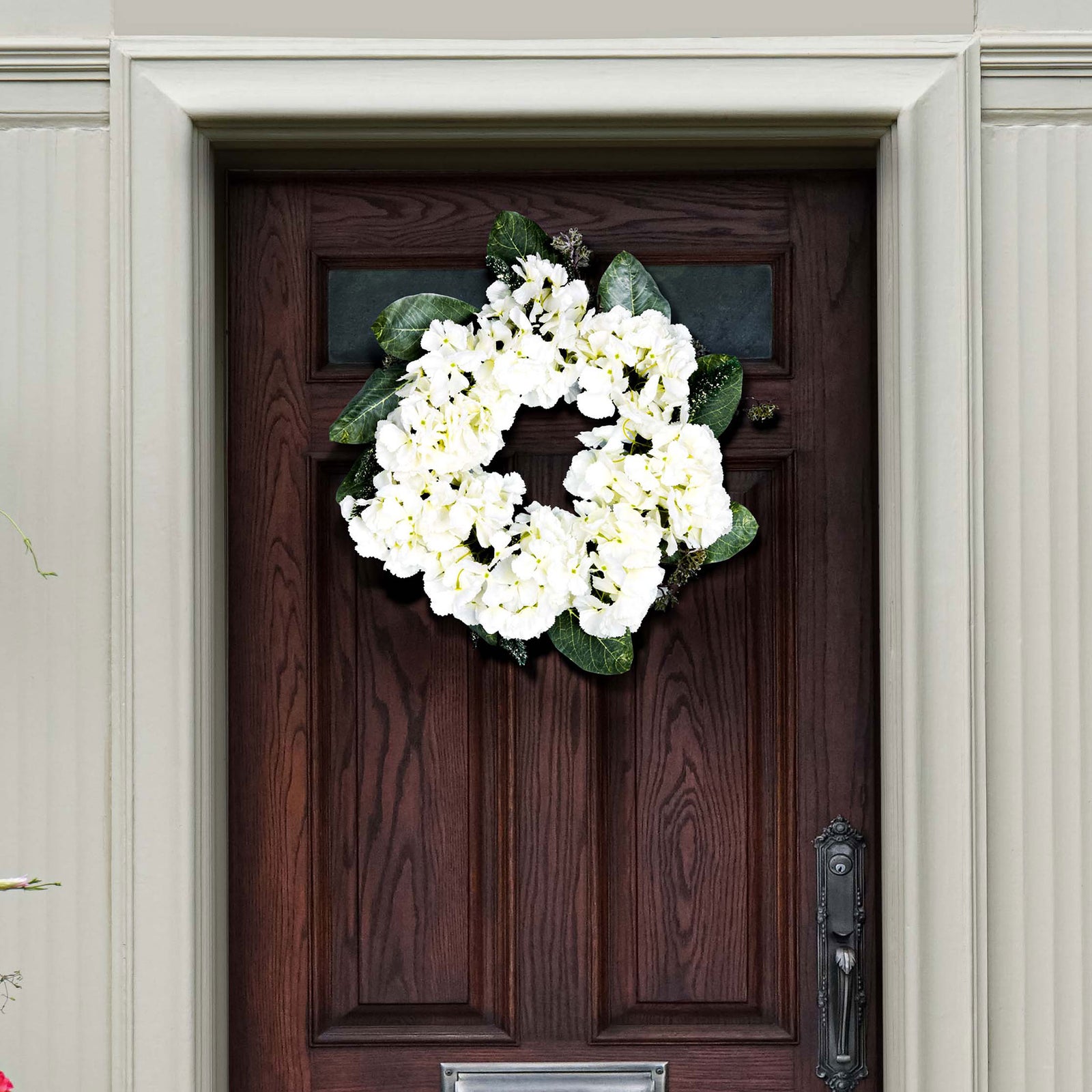 White hydrangea clusters brighten a dark door with lush spring color. || FXP1037A || front_room
