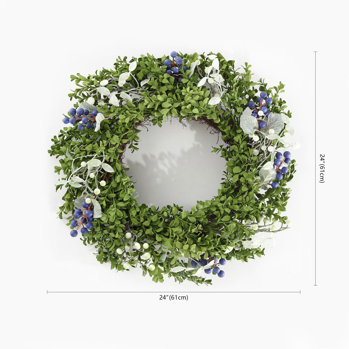 A 24-inch boxwood wreath is dotted with blue and white berries.