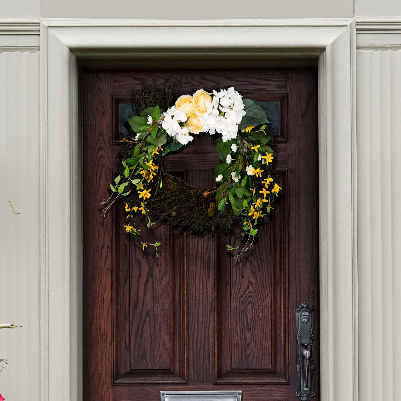 White hydrangeas and cream blossoms add a cheerful touch to a wood door. || FXP1039A || front_room