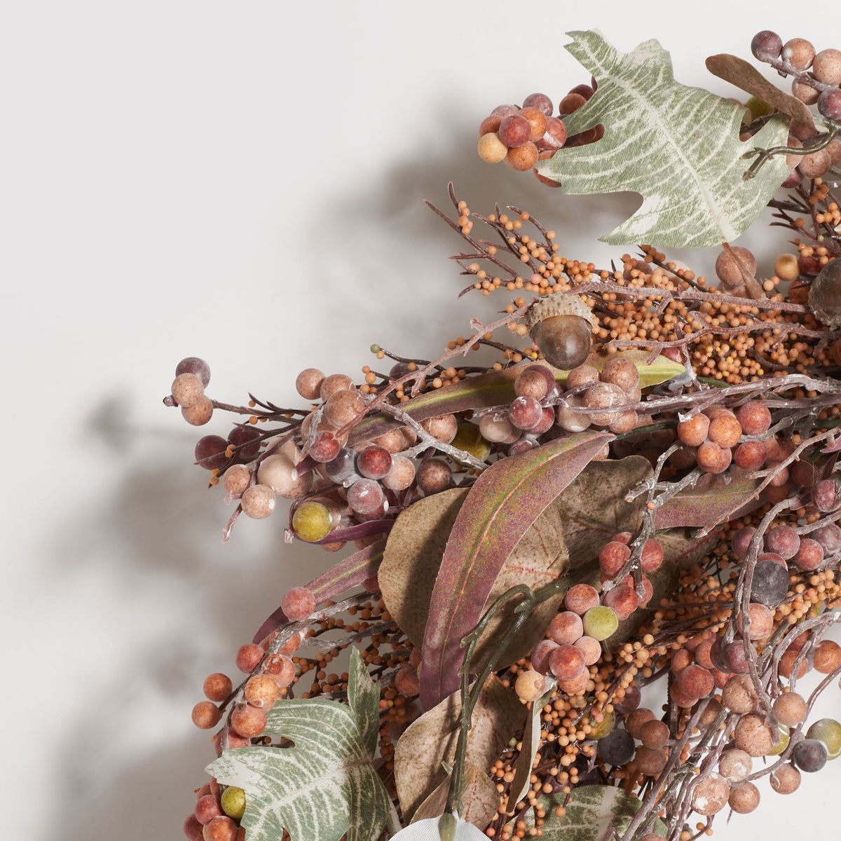 Coppery berry clusters mingle with acorns, textured leaves, and fine twigs. || FXP1044A || detail_studio