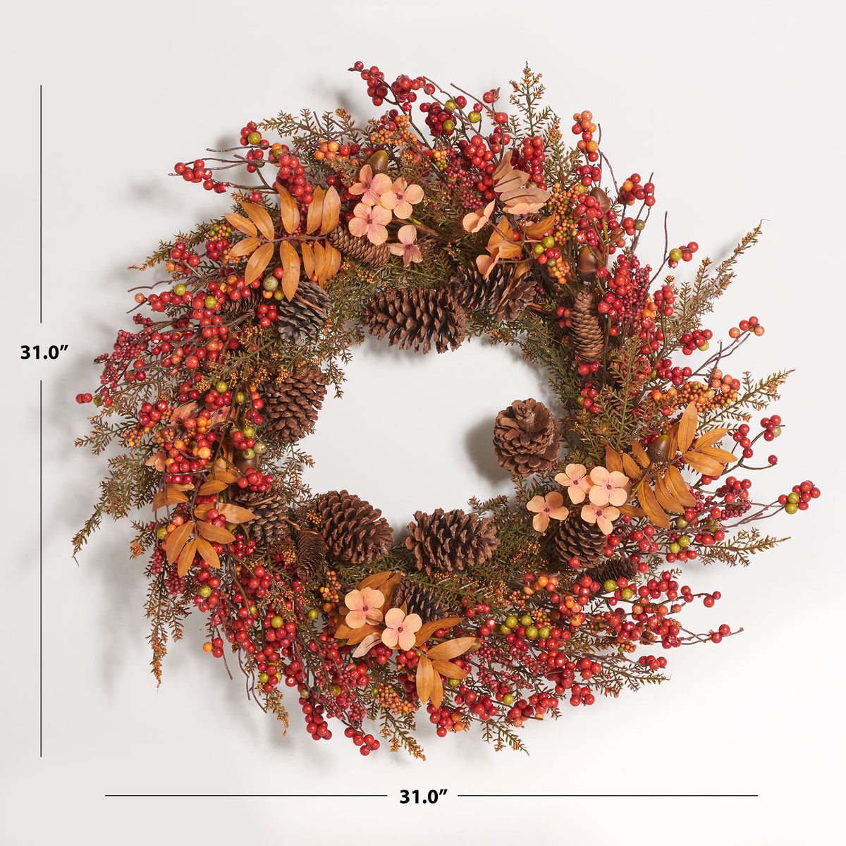 A 31-inch wreath layers colorful berries, pine cones, and delicate flowers. || FXP1050A || dimension_studio