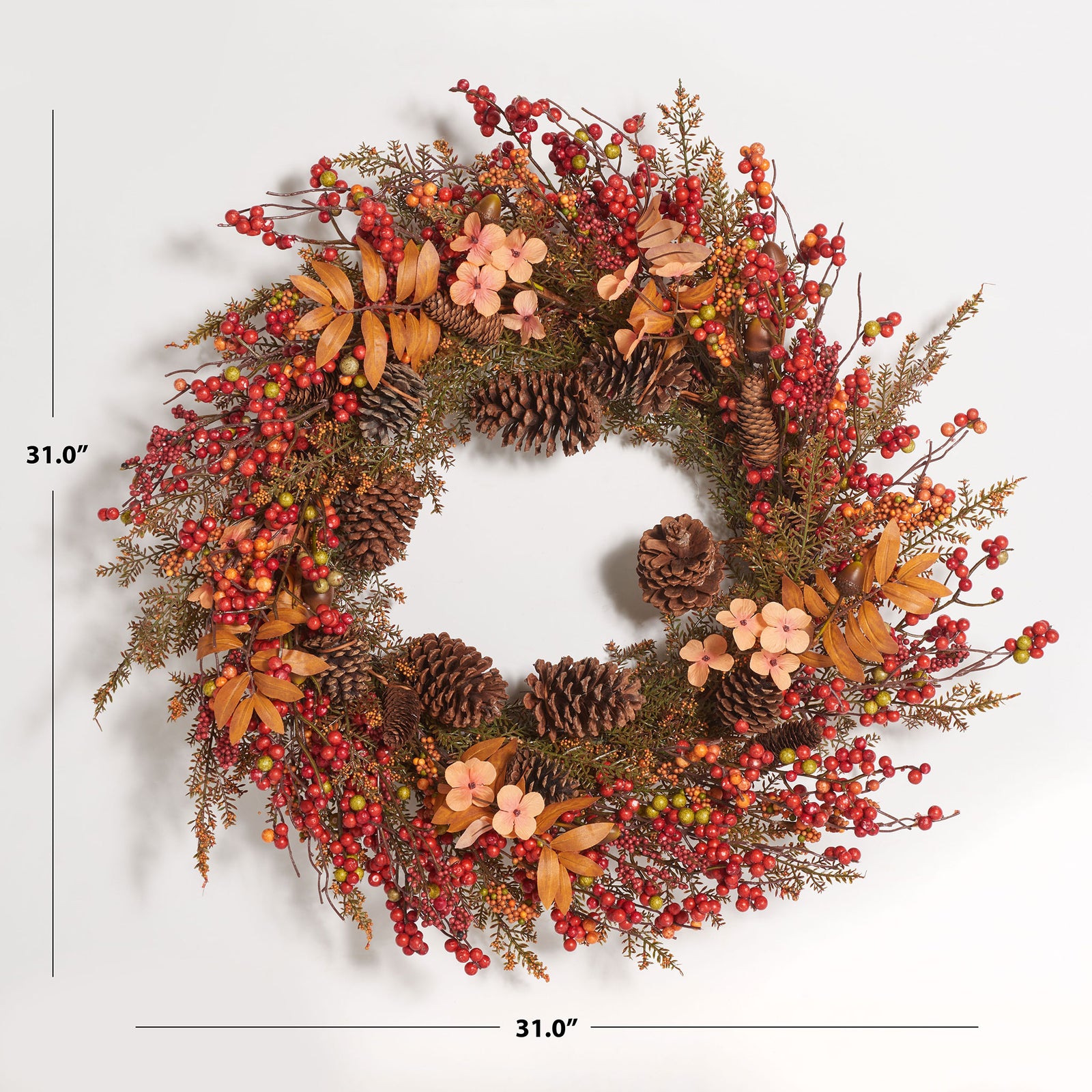 A 31-inch wreath layers colorful berries, pine cones, and delicate flowers. || FXP1050A || dimension_studio