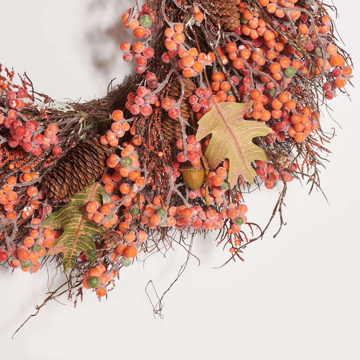 Bright berry clusters surround faux oak leaves, acorns, and pine cones. || FXP1054A || detail_studio