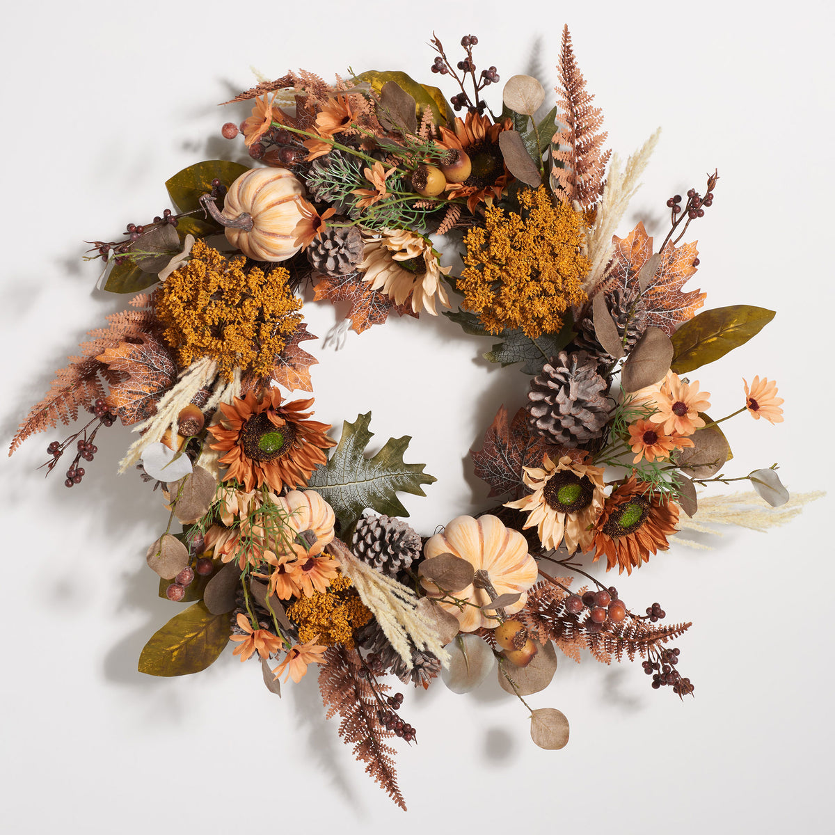 Cream pumpkins and golden flowers brighten richly textured fall foliage. || FXP1056A || front_studio