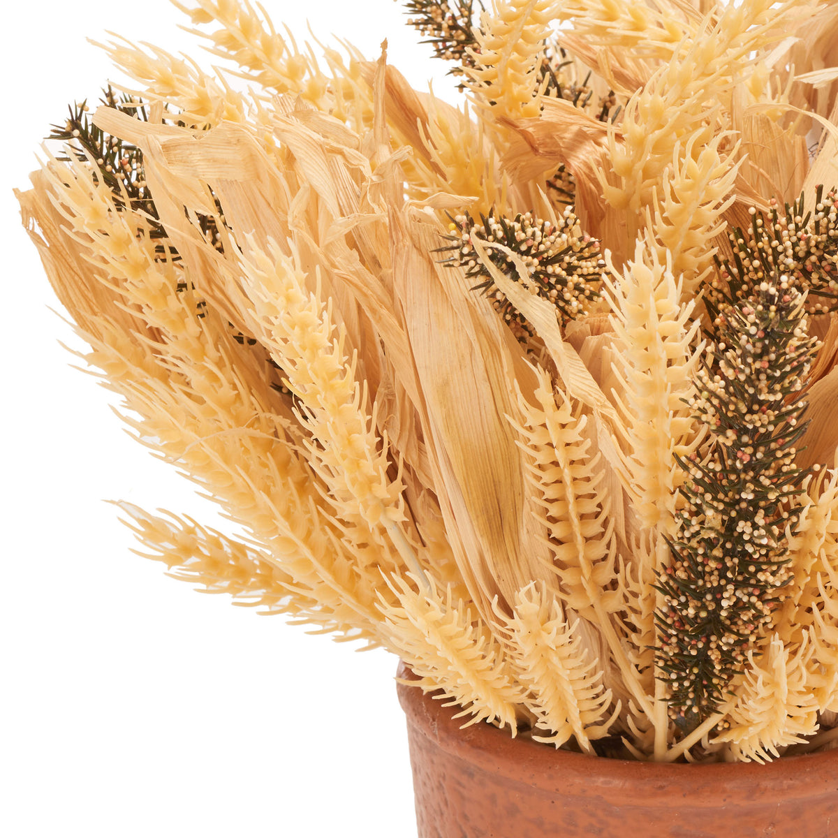 Golden wheat ears mix with deeper brown seed heads above a clay pot. || FXP1059A || detail_studio