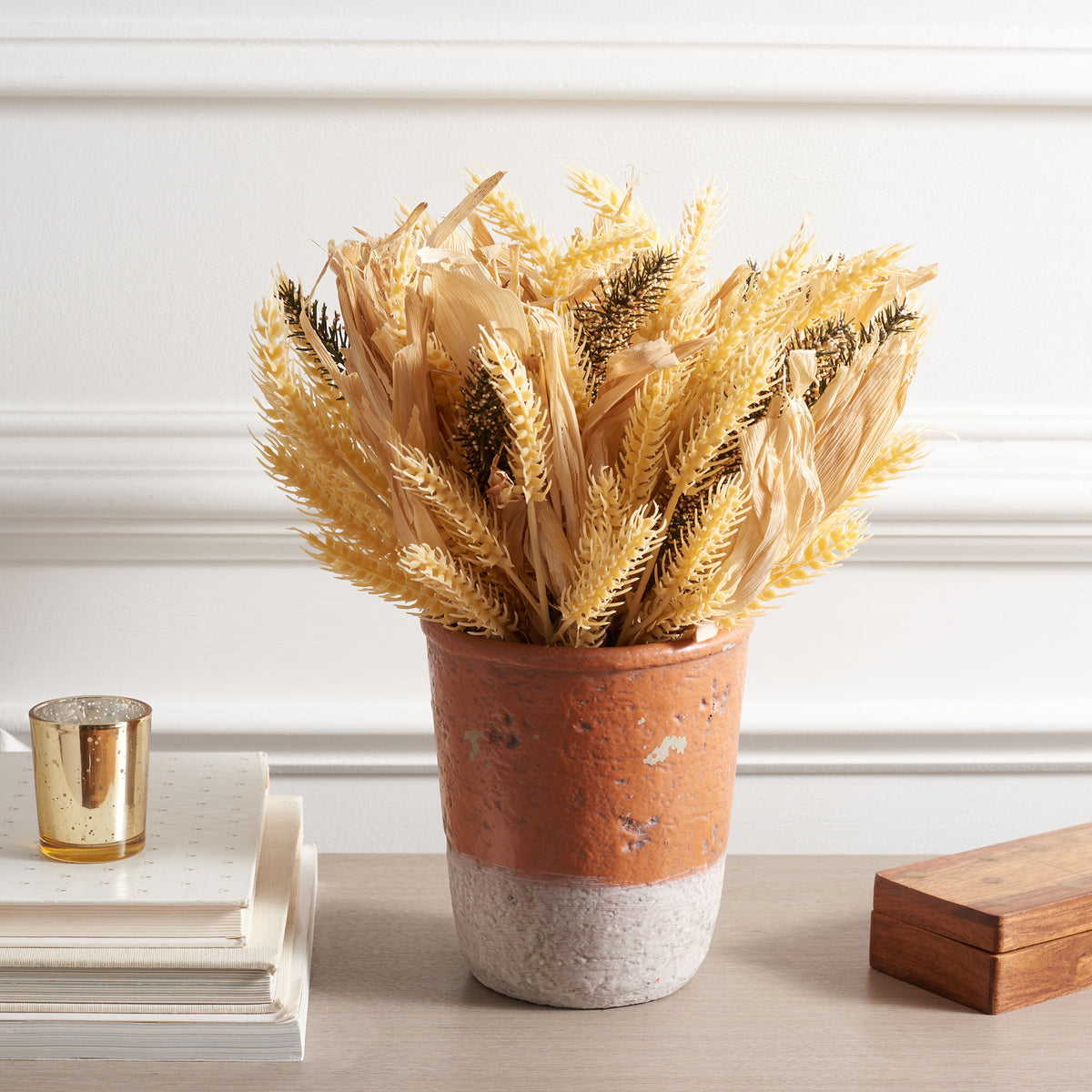 A wheat-inspired arrangement brings warm harvest color to a tabletop.