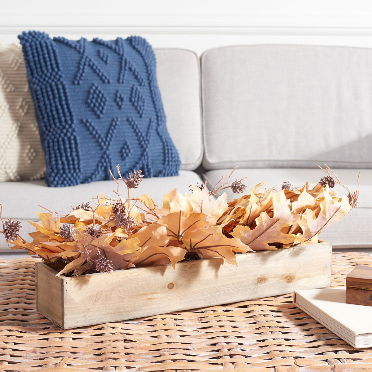 A low maple leaf centerpiece brings warm harvest color to a coffee table. || FXP1066A || front_room