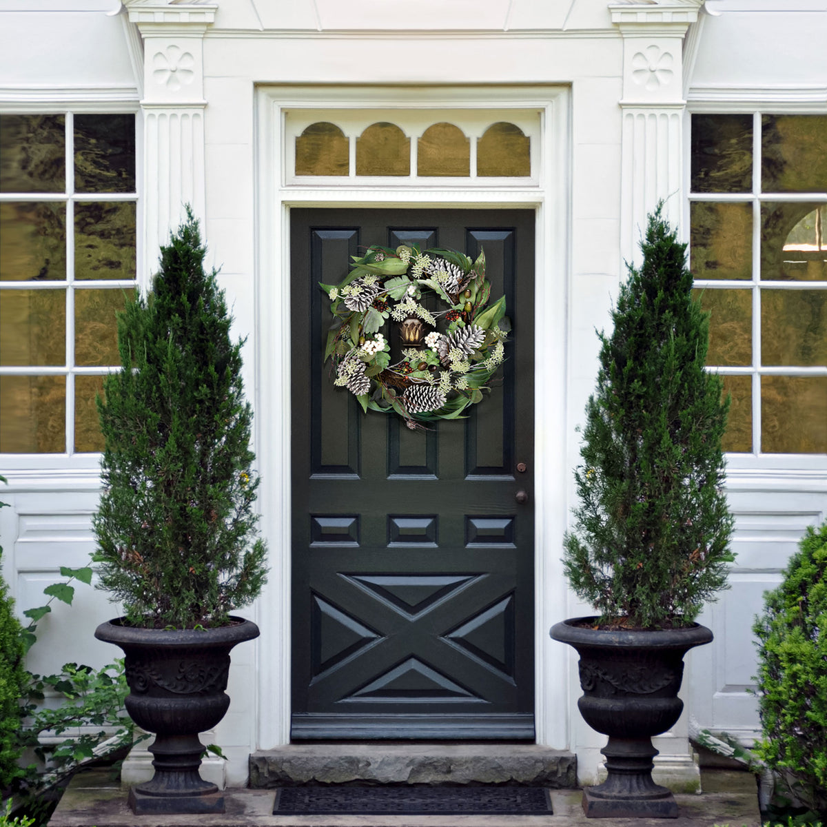 A leafy winter wreath adds a natural holiday accent to the entryway. || FXP1072A || front_room