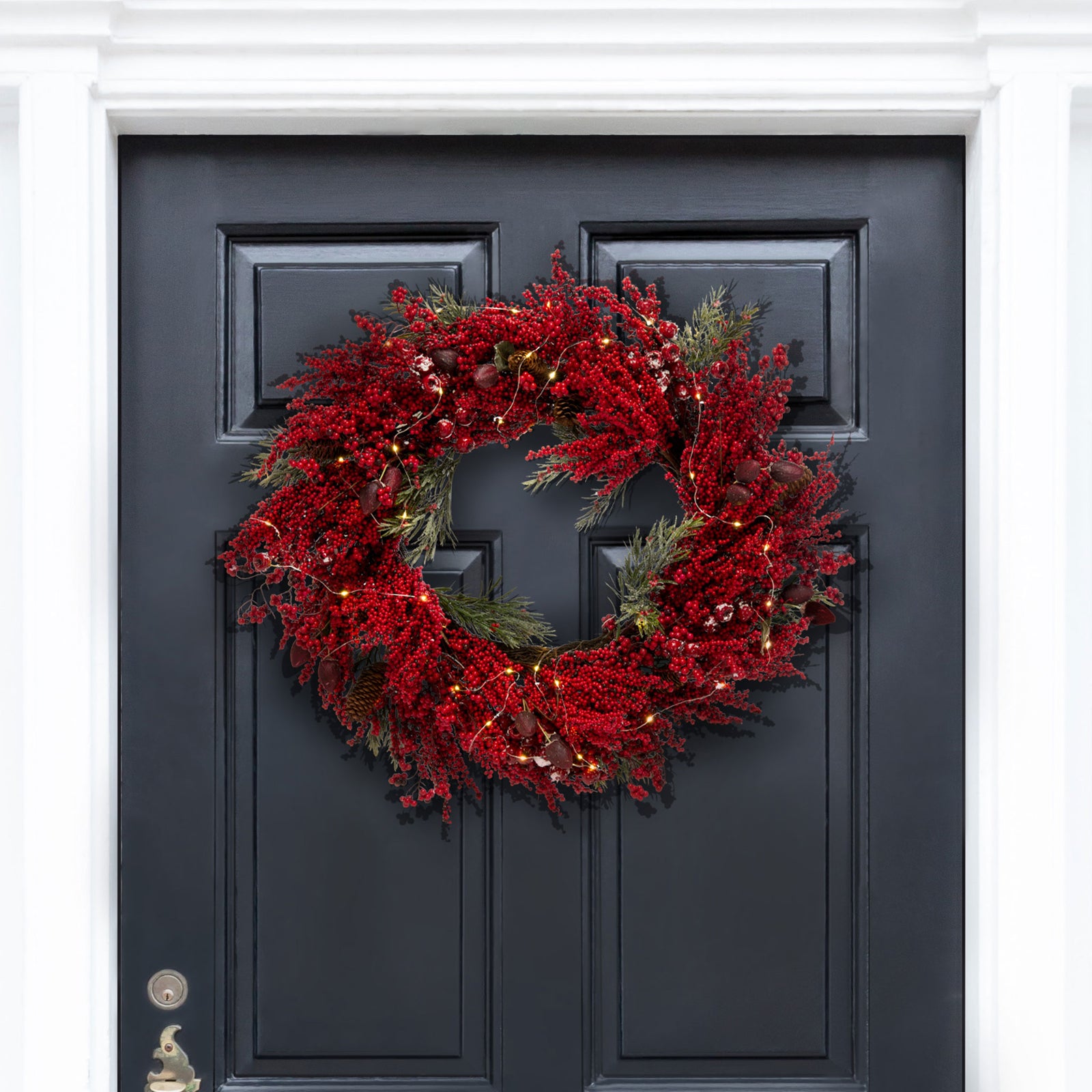 Crimson berry clusters and pine sprigs make a striking holiday door accent. || FXP1093A || front_room