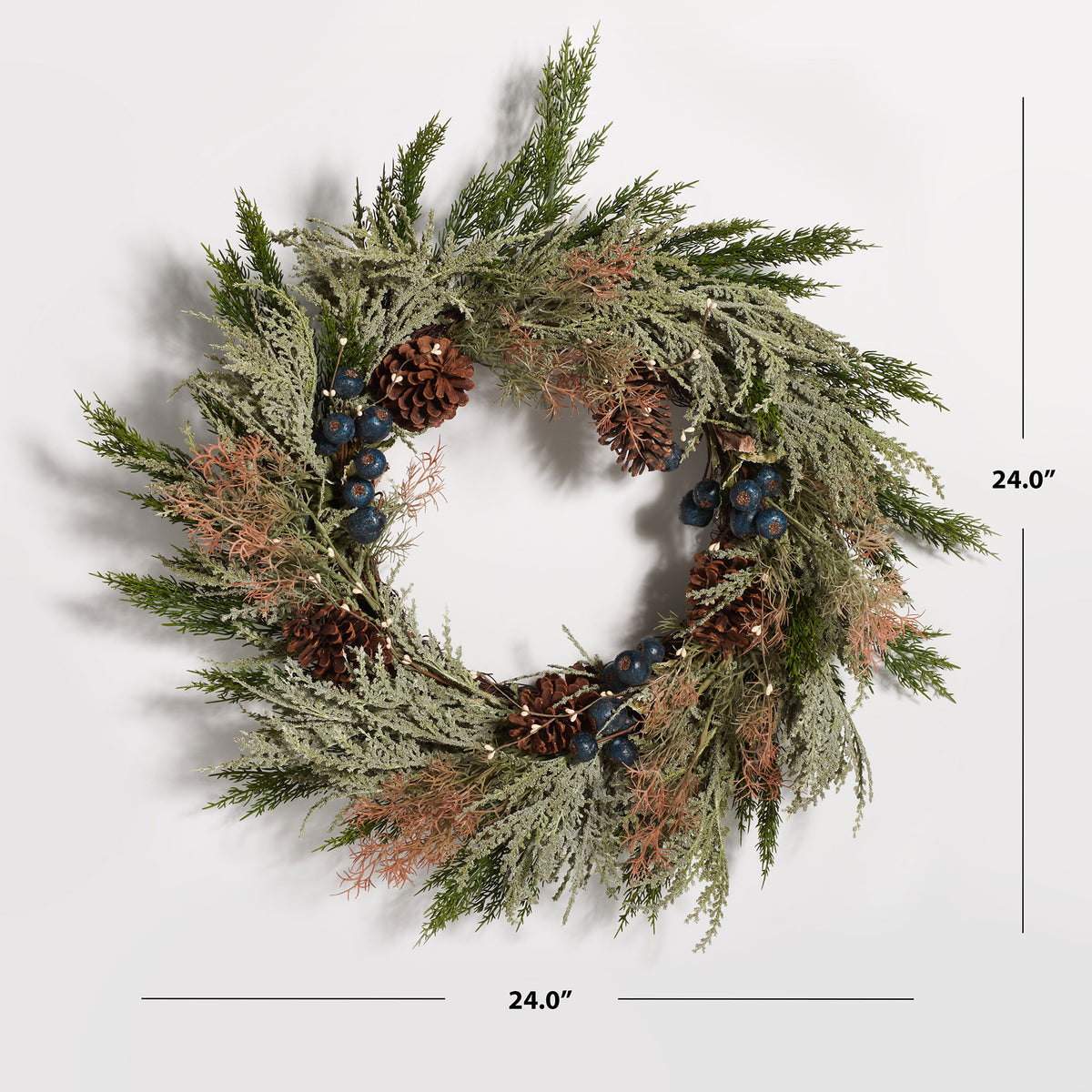 A 24-inch pine wreath combines blueberries and rustic pine cones. || FXP1094A || dimension_studio