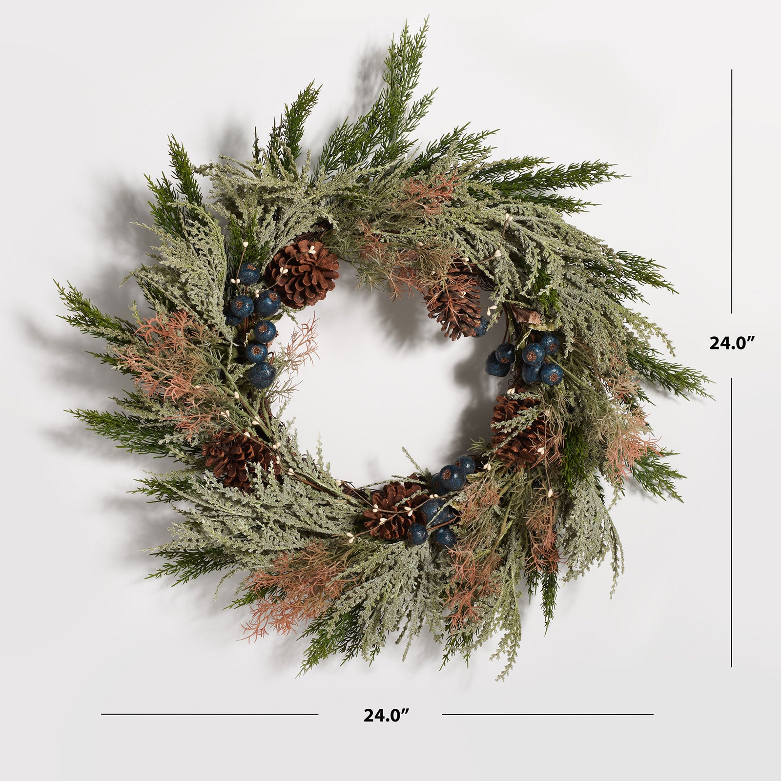 A 24-inch pine wreath combines blueberries and rustic pine cones. || FXP1094A || dimension_studio