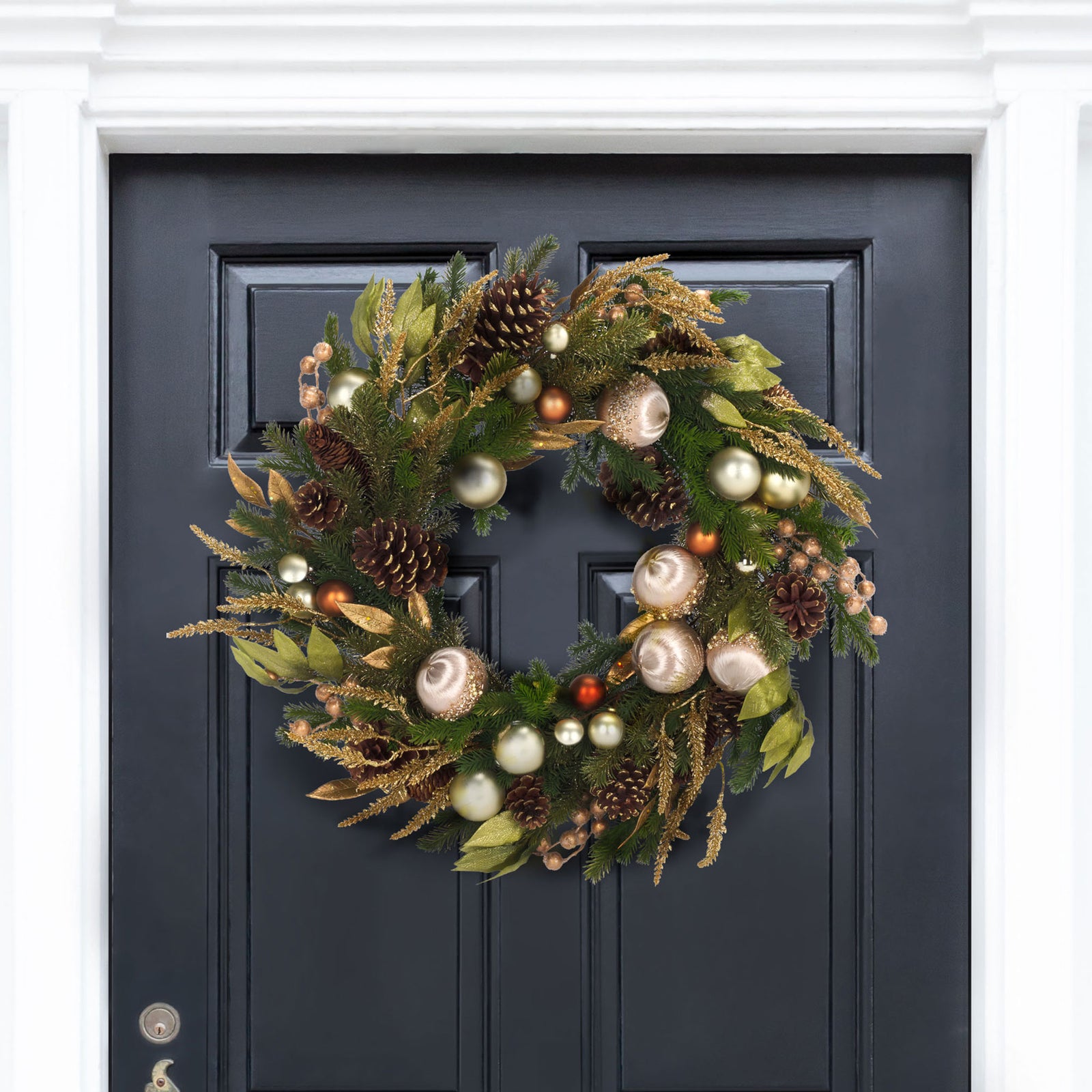 Champagne ornaments and gold foliage add festive sparkle to a dark entry door || FXP1098A || front_room